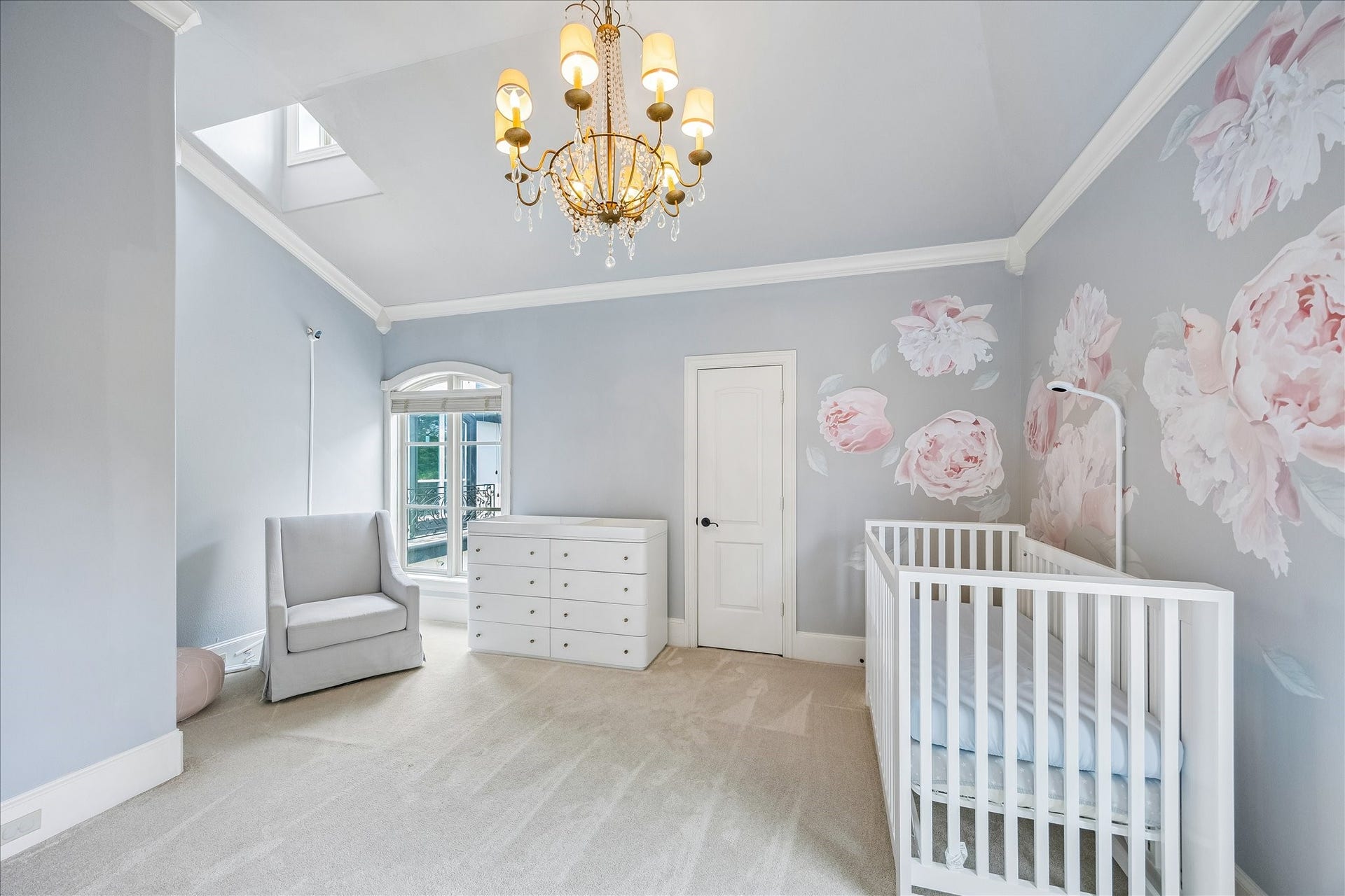 4802 Saxon Street, Bellaire, TX 77401 Secondary bedroom with elegant chandelier. Custom windows bring so much light in.
