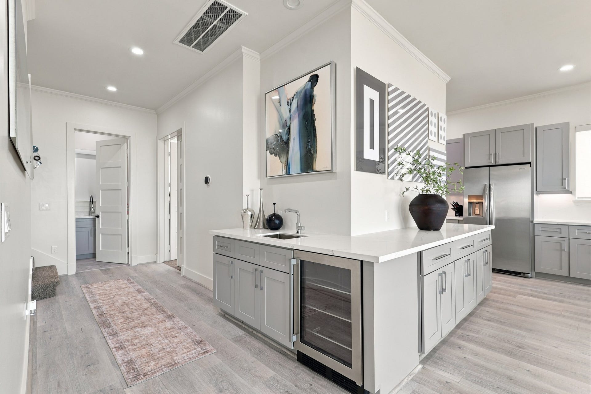 17211 Termini San Luis Pass Rd, Galveston, TX 77554 Entertain with ease at the centrally located wet bar, featuring a beverage refrigerator, prep sink, and generous cabinetry. Its convenient position beside the kitchen keeps refreshments close at hand.