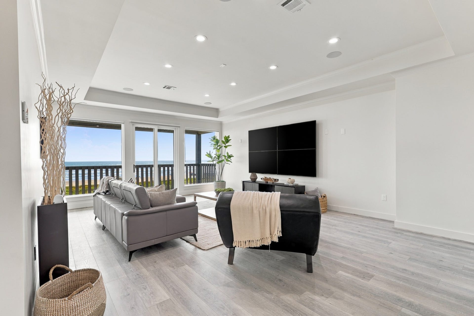 17211 Termini San Luis Pass Rd, Galveston, TX 77554 Additional Gulf-facing living area
A separate living area offers another inviting place to relax, with expansive Gulf views and sliding glass doors opening to a covered deck. A tray ceiling adds architectural definition.
Photo 26 Additional living area, reverse view