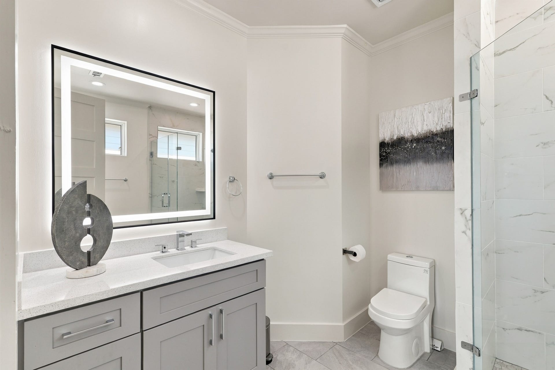 17211 Termini San Luis Pass Rd, Galveston, TX 77554 Gulf-view bedroom, alternate view
This reverse perspective highlights the bedrooms spacious layout, closet shelving, and access to an adjoining bathroom. Crown molding and a layered tray ceiling bring architectural interest to the retreat.
