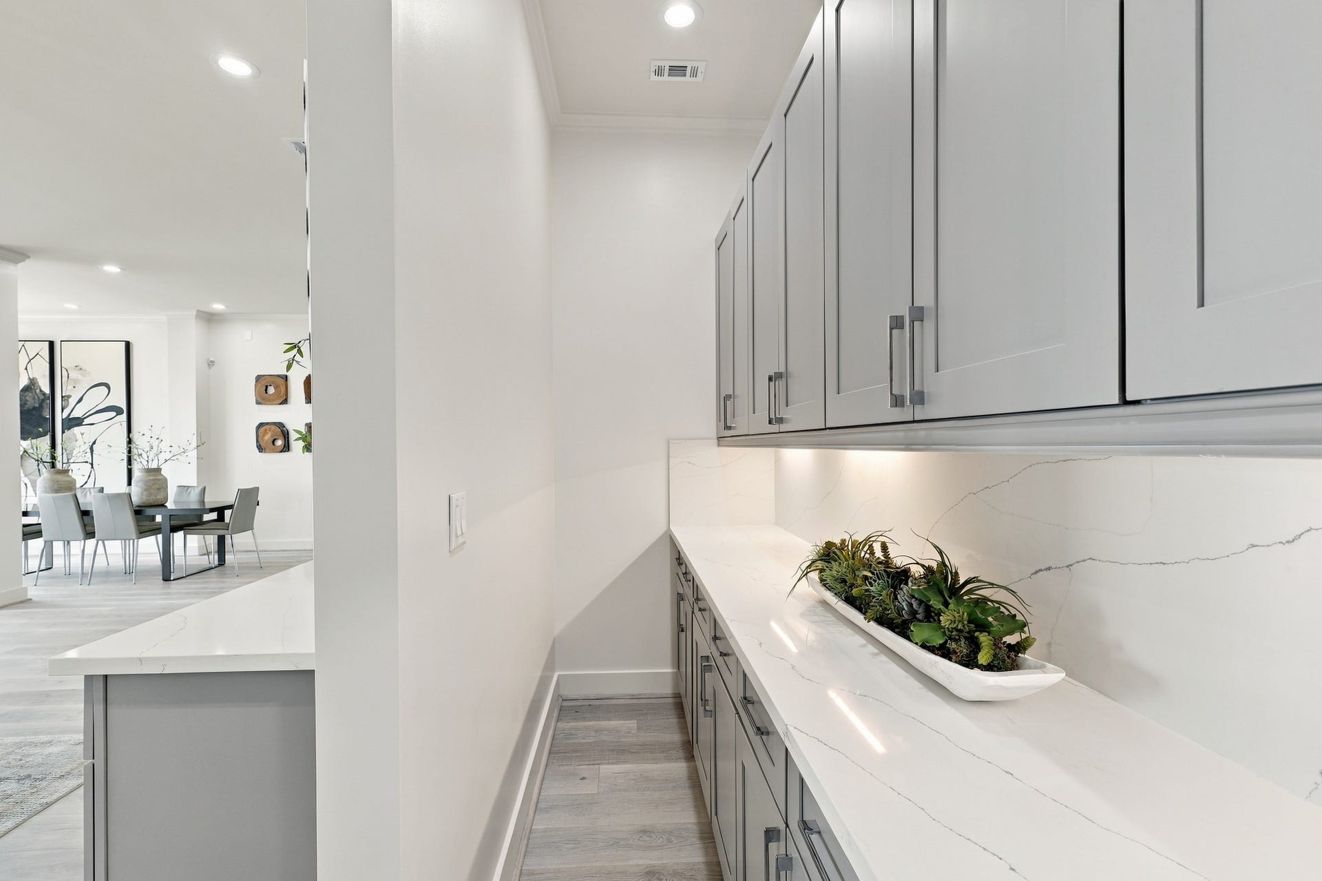 17211 Termini San Luis Pass Rd, Galveston, TX 77554 An extended counter and additional upper and lower cabinetry provide valuable storage and serving space, conveniently tucked alongside the main kitchen.