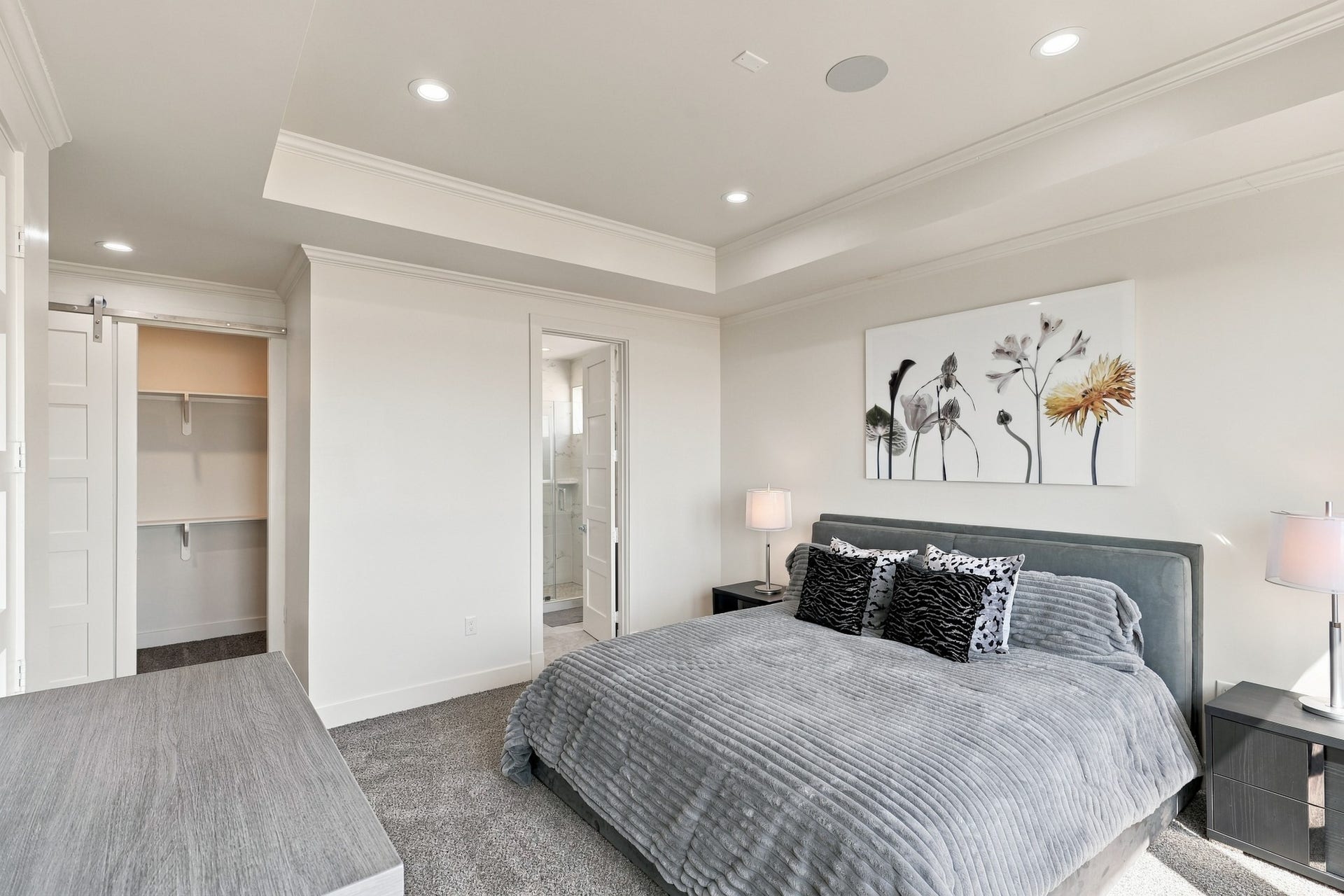 17211 Termini San Luis Pass Rd, Galveston, TX 77554 Forth Gulf-view bedroom, alternate view
This reverse perspective highlights the bedrooms spacious layout, closet shelving, and access to an adjoining bathroom. Crown molding and a layered tray ceiling bring architectural interest to the retreat.
