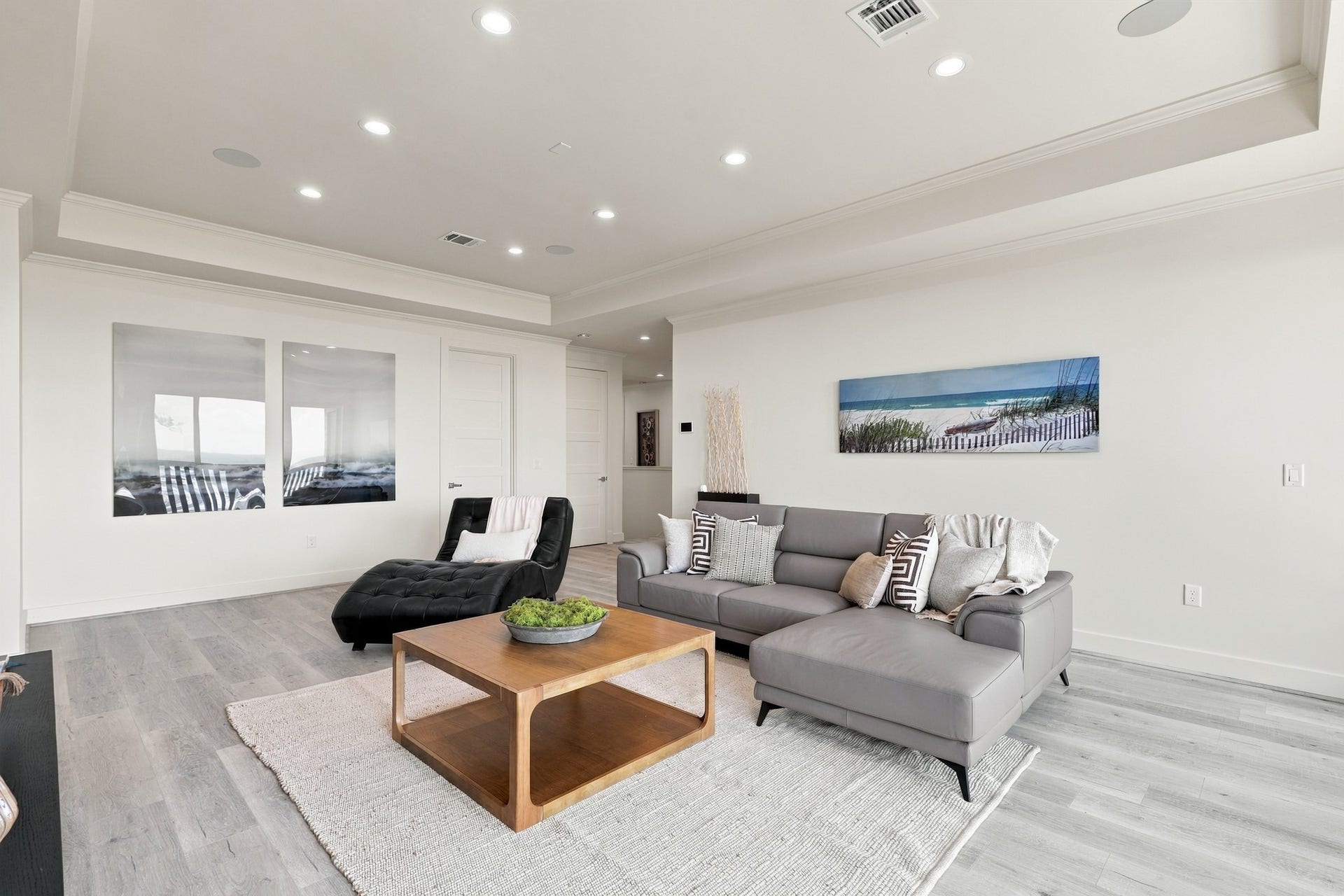 17211 Termini San Luis Pass Rd, Galveston, TX 77554 Additional Family area, reverse view
This reverse view showcases the additional living areas spacious layout, recessed lighting, and cohesive coastal finishes. Plenty of room to gather, unwind, or enjoy a movie night.