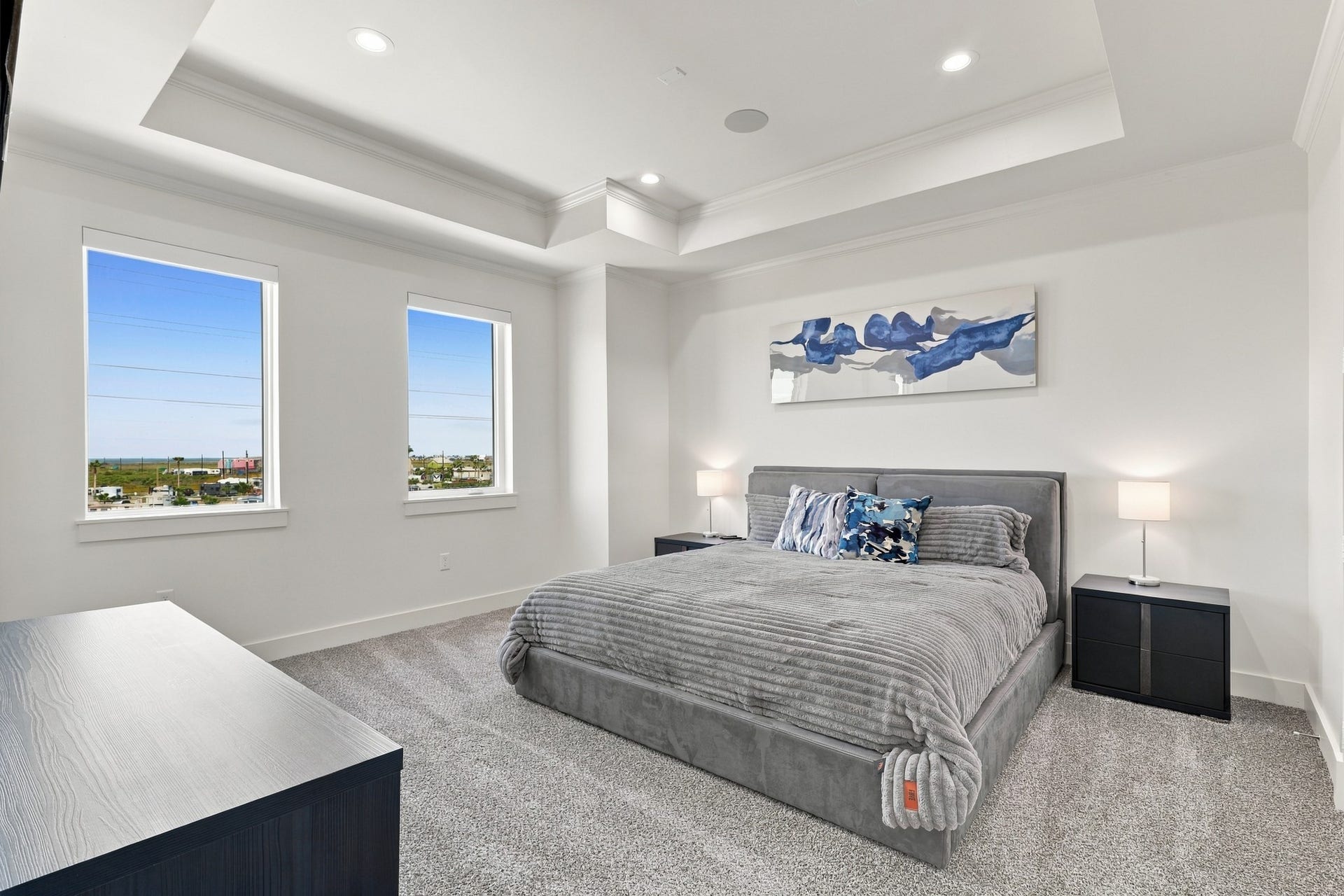 17211 Termini San Luis Pass Rd, Galveston, TX 77554 Third bedroom
A spacious secondary bedroom featuring a distinctive tray ceiling, soft carpeting, and two tall windows. Natural light and understated finishes create a restful coastal retreat.