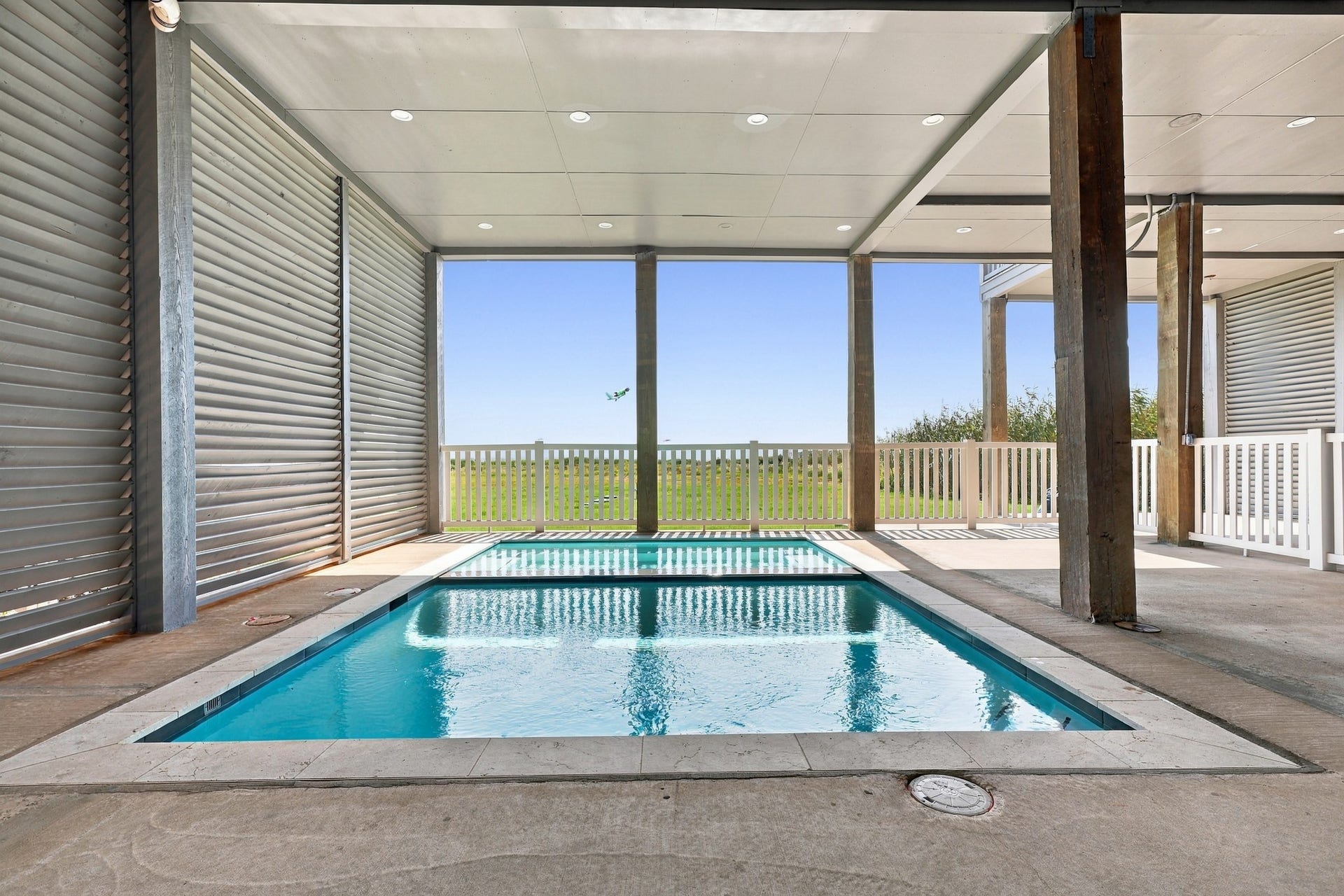 17211 Termini San Luis Pass Rd, Galveston, TX 77554 Covered pool and spa
Enjoy a private pool and adjoining spa beneath the homes covered outdoor area. Open views toward the dunes and Gulf create a distinctive setting for relaxing after a day on the beach.