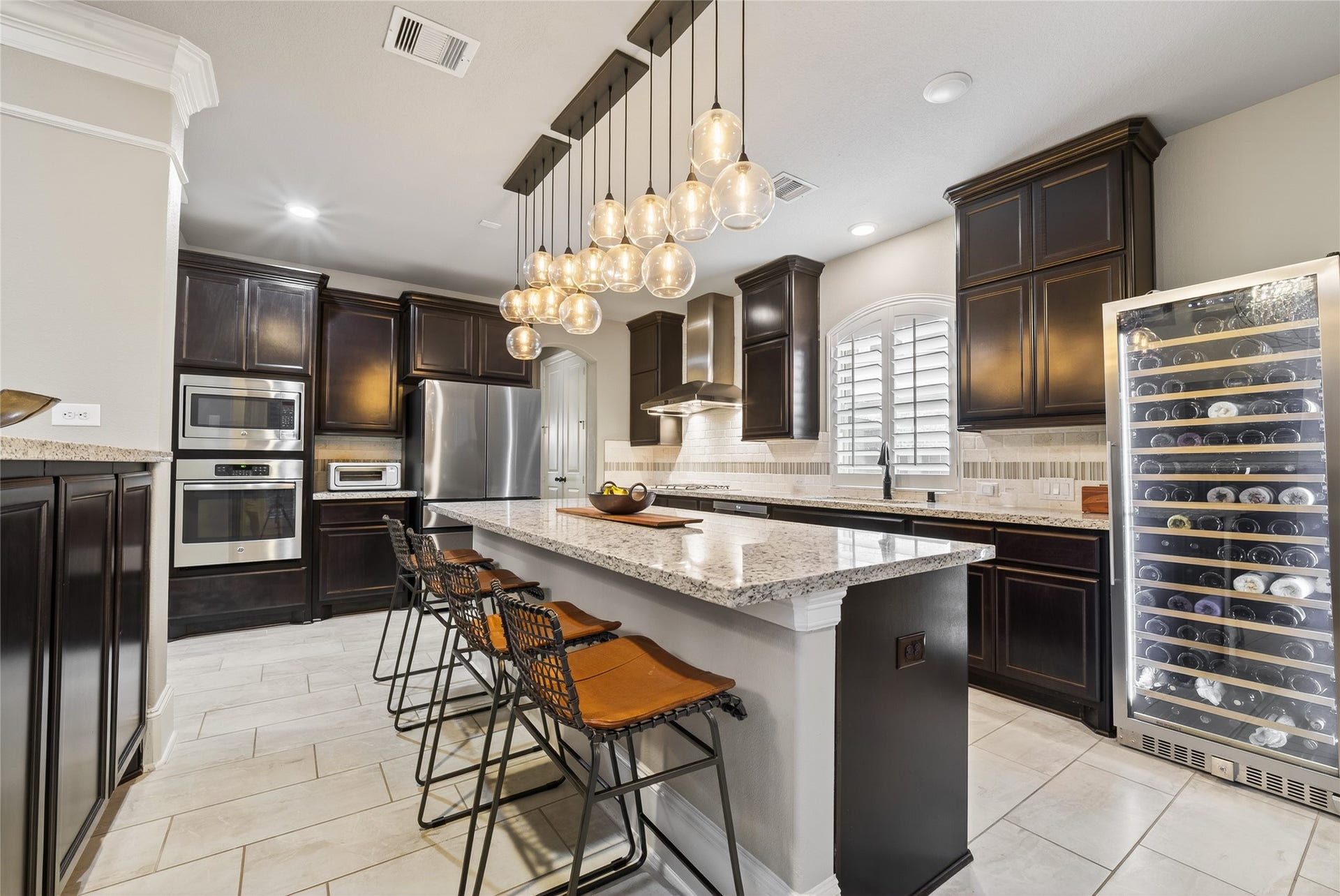 7907 Augusta Creek Court, Spring, TX 77389 The kitchen and family room flow effortlessly into each other allowing easy entertaining.