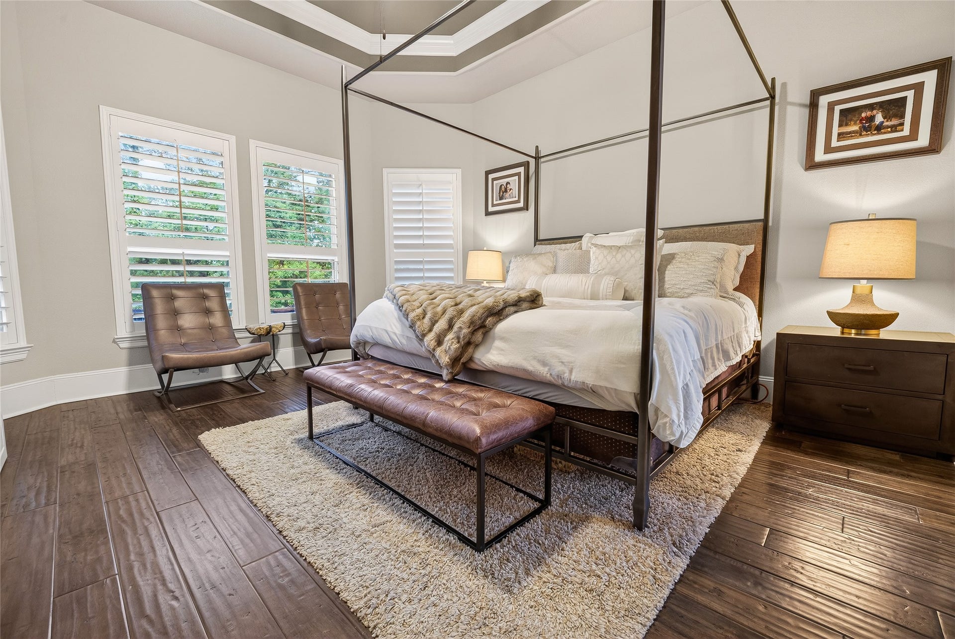 7907 Augusta Creek Court, Spring, TX 77389 This primary retreat offers the luxury style tray ceilings and warm tones.