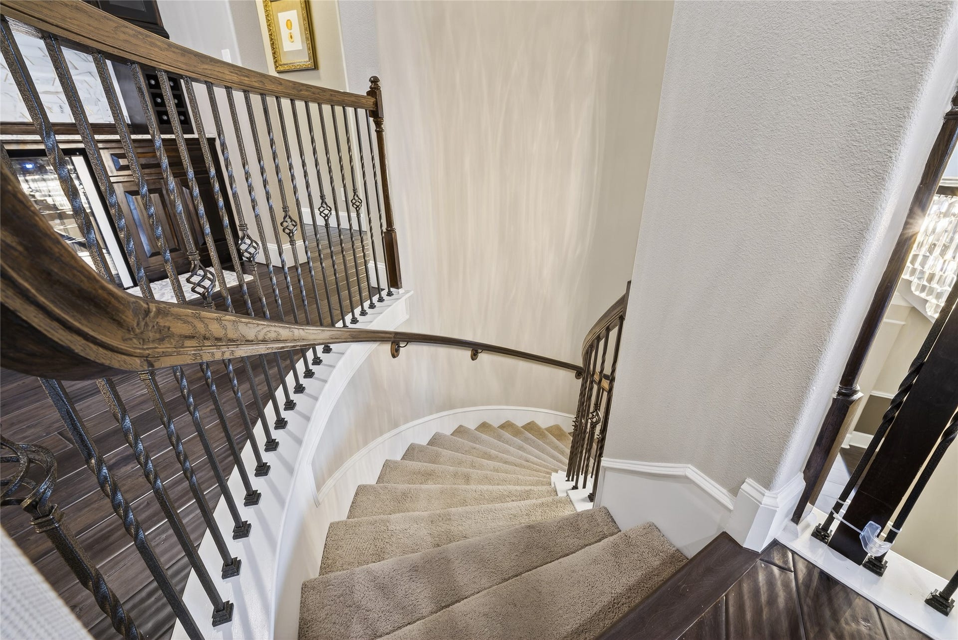 7907 Augusta Creek Court, Spring, TX 77389 What a luxury vibe. The wrought iron curved staircase really does make a statement.
