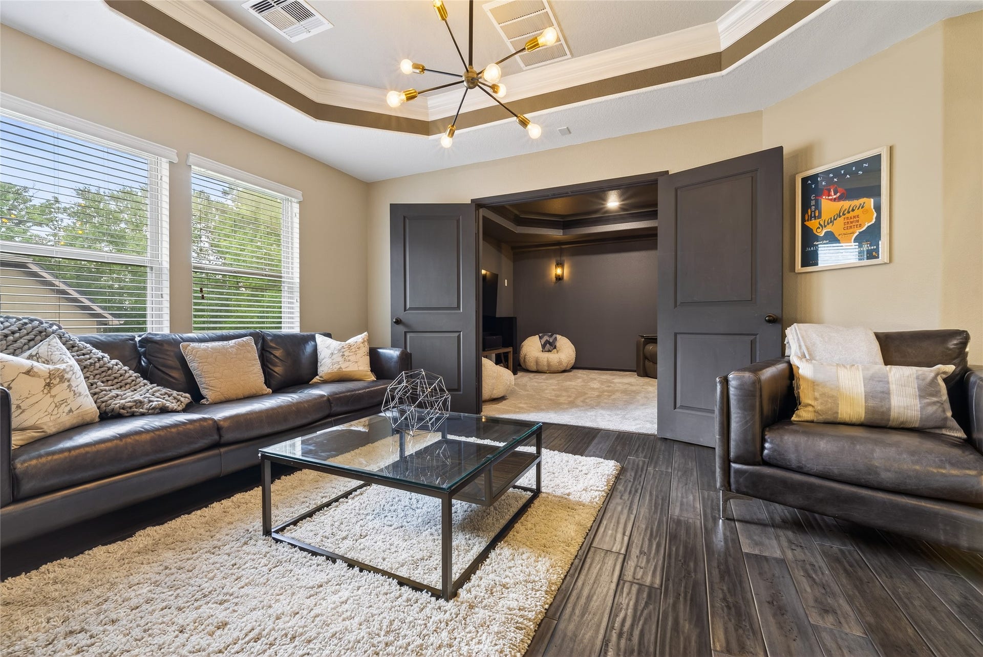 7907 Augusta Creek Court, Spring, TX 77389 Stunning tray ceiling with modern lighting really make this room pop. Charcoal gray double doors lead you into movie night!