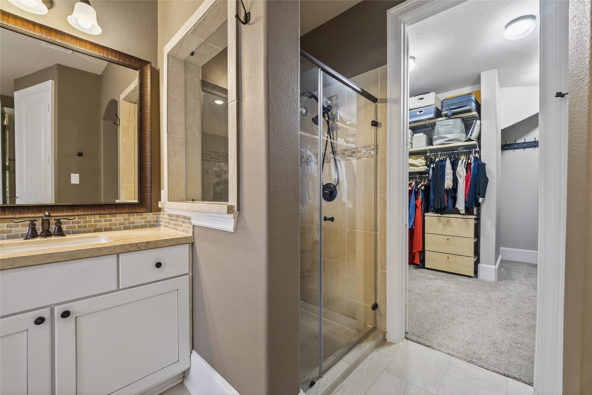 7907 Augusta Creek Court, Spring, TX 77389 A separate shower awaits you and a generous primary closet to hold all your items.