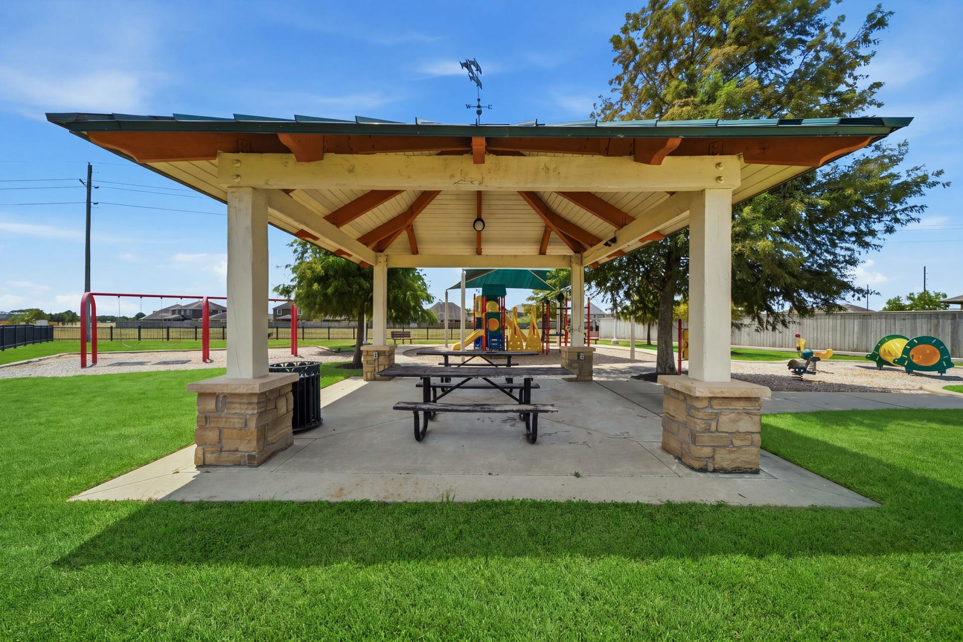 15435 Kaston Drive, Cypress, TX 77433 Shaded by a spacious pavilion with stone-accented pillars and picnic tables, this park area sits adjacent to a vibrant neighborhood playground.