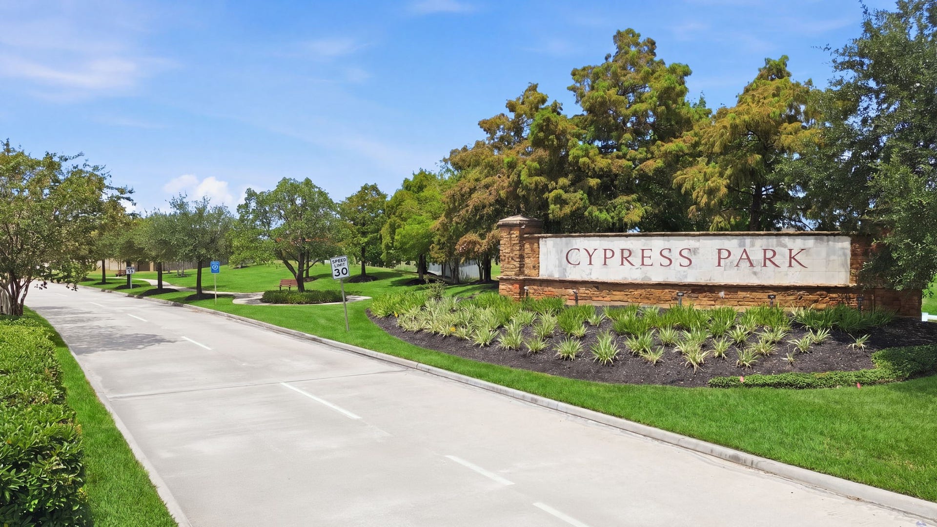 15435 Kaston Drive, Cypress, TX 77433 Cypress Park stone monument sign marks the entrance to Cypress Landing, highlighting a landscaped boulevard in a rapid growth area.