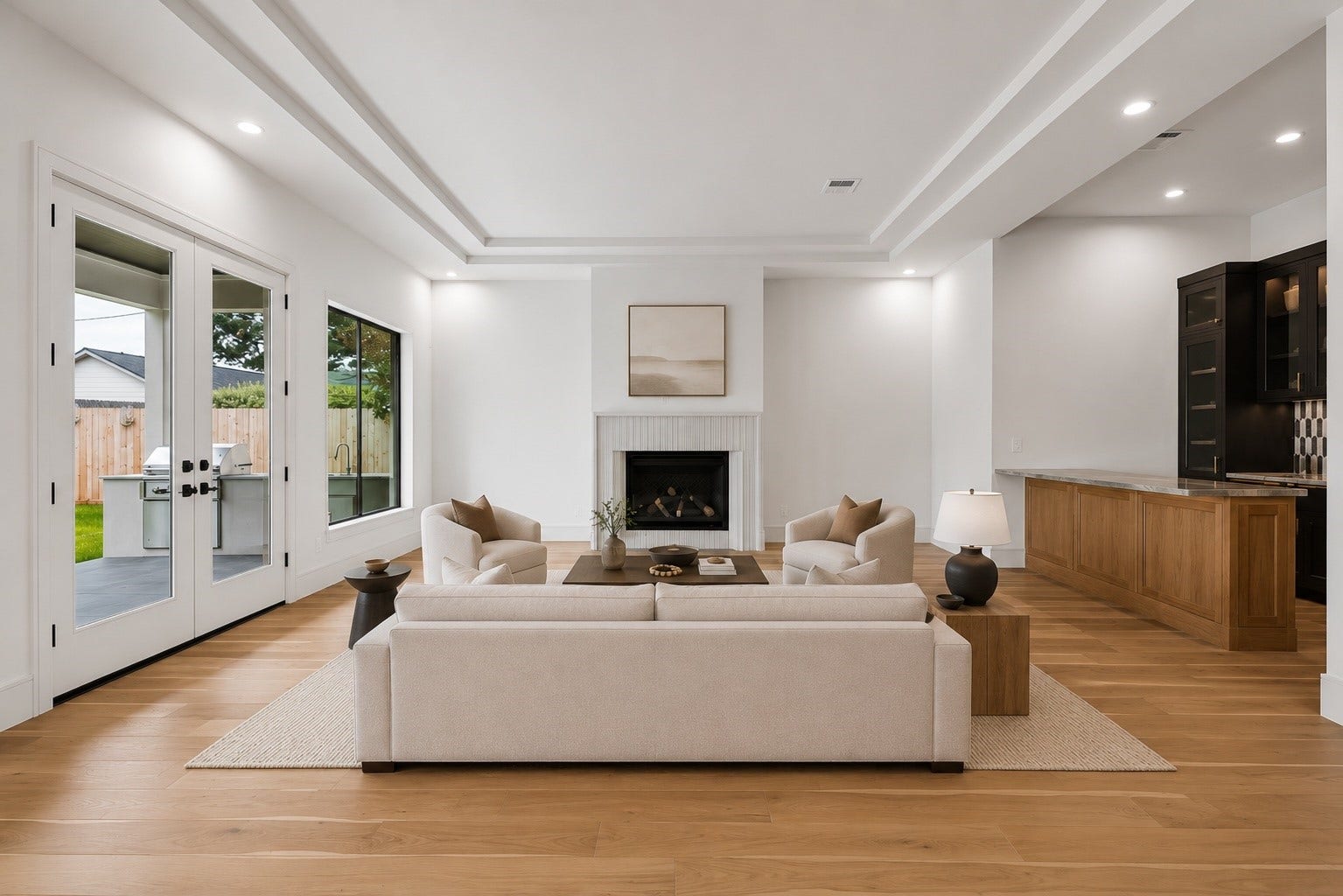 316 W 30th Street, Houston, TX 77018 Gather around the fireplace or open the doors to the covered patio for effortless indoor outdoor living. Soaring tray ceilings, expansive windows, and a seamless connection to the kitchen and wet bar make this the heart of the home. **Virtually staged**