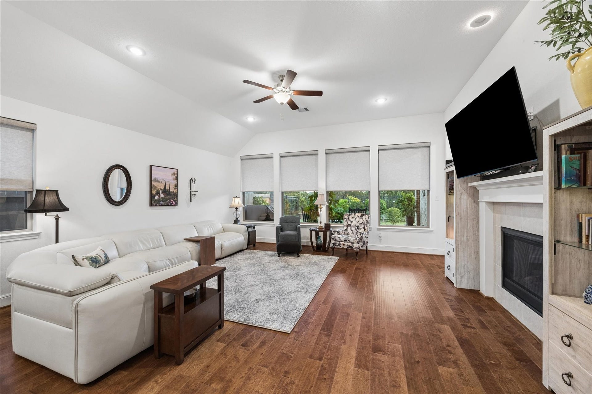 A view of the living room overlooking the lush backyard