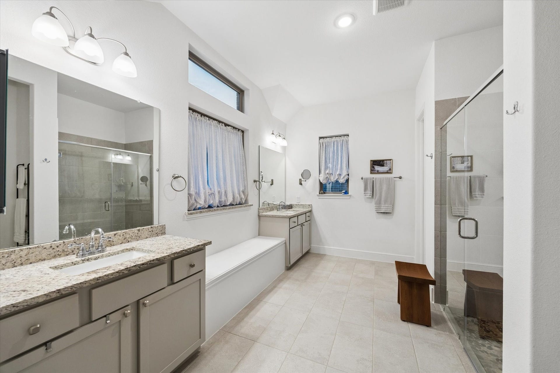 An extra-large bathroom and walk-in shower complete the primary suite
