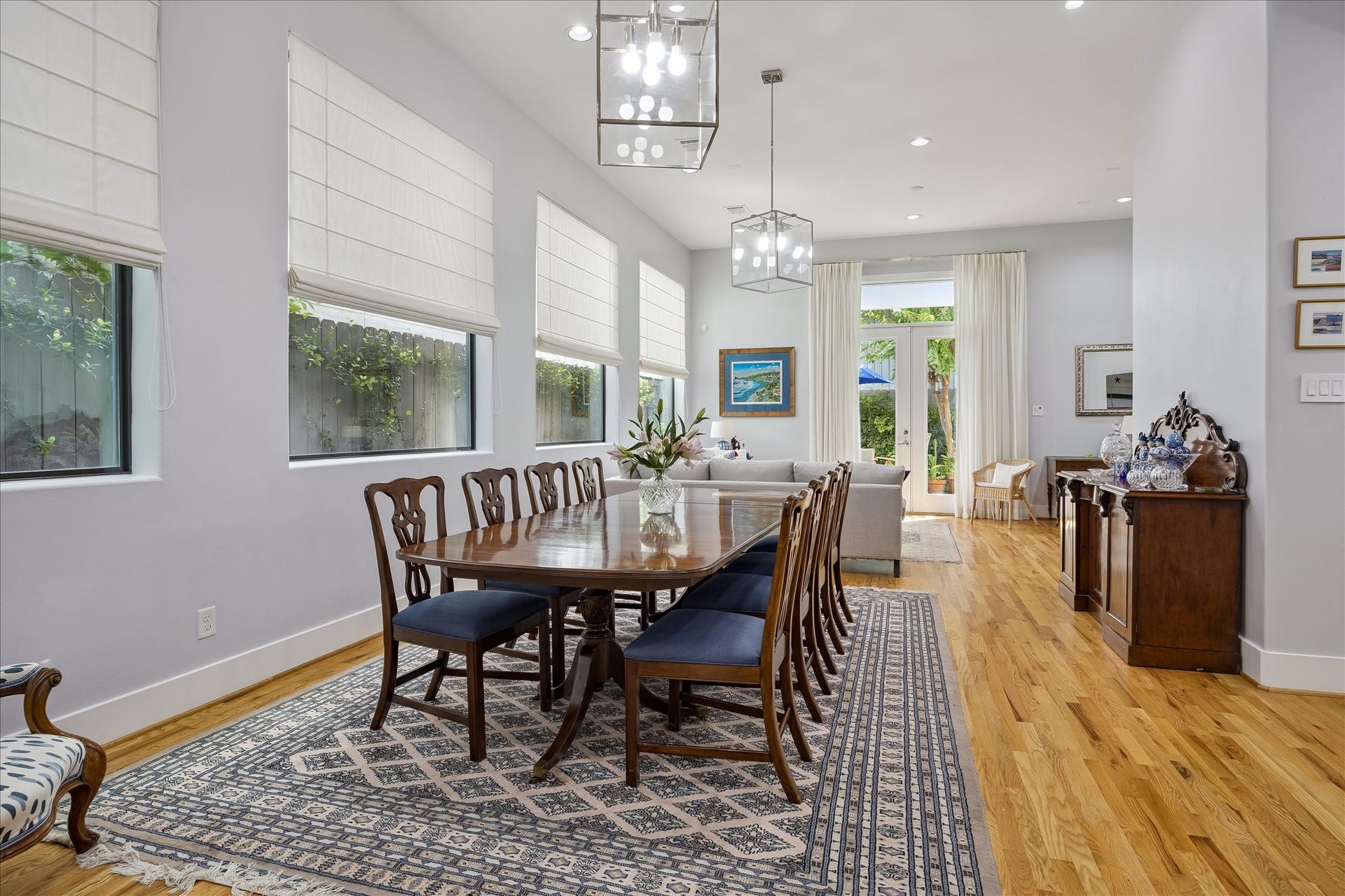 The elegant DINING ROOM is conveniently located between the kitchen and living room perfect for easy entertaining. Large picture windows offer an abundance of natural light while still allowing complete privacy.