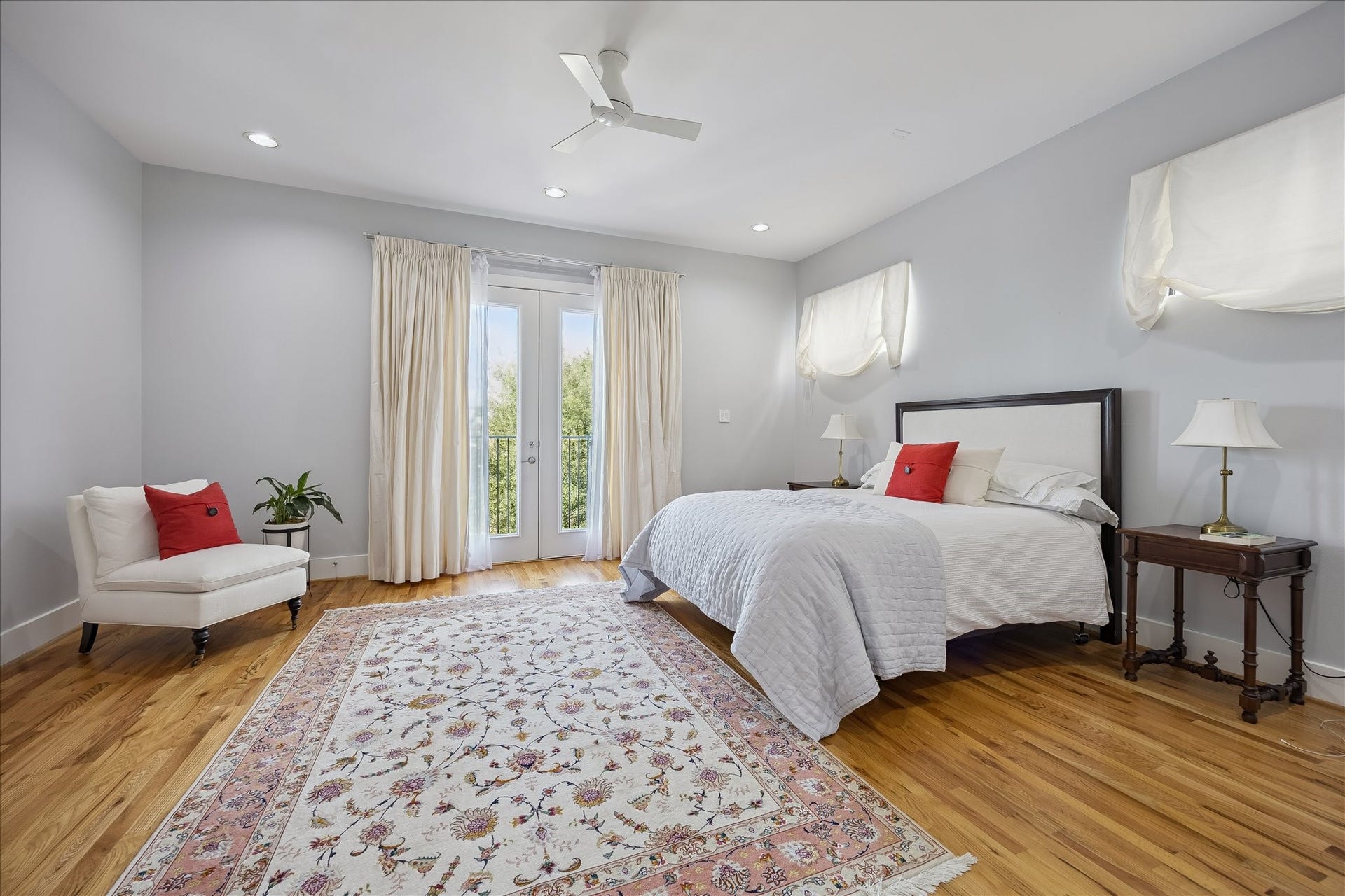 Bathed in natural light, the oversized PRIMARY BEDROOM on the second floor offers space for a seating area or desk space with double doors leading to a private balcony.