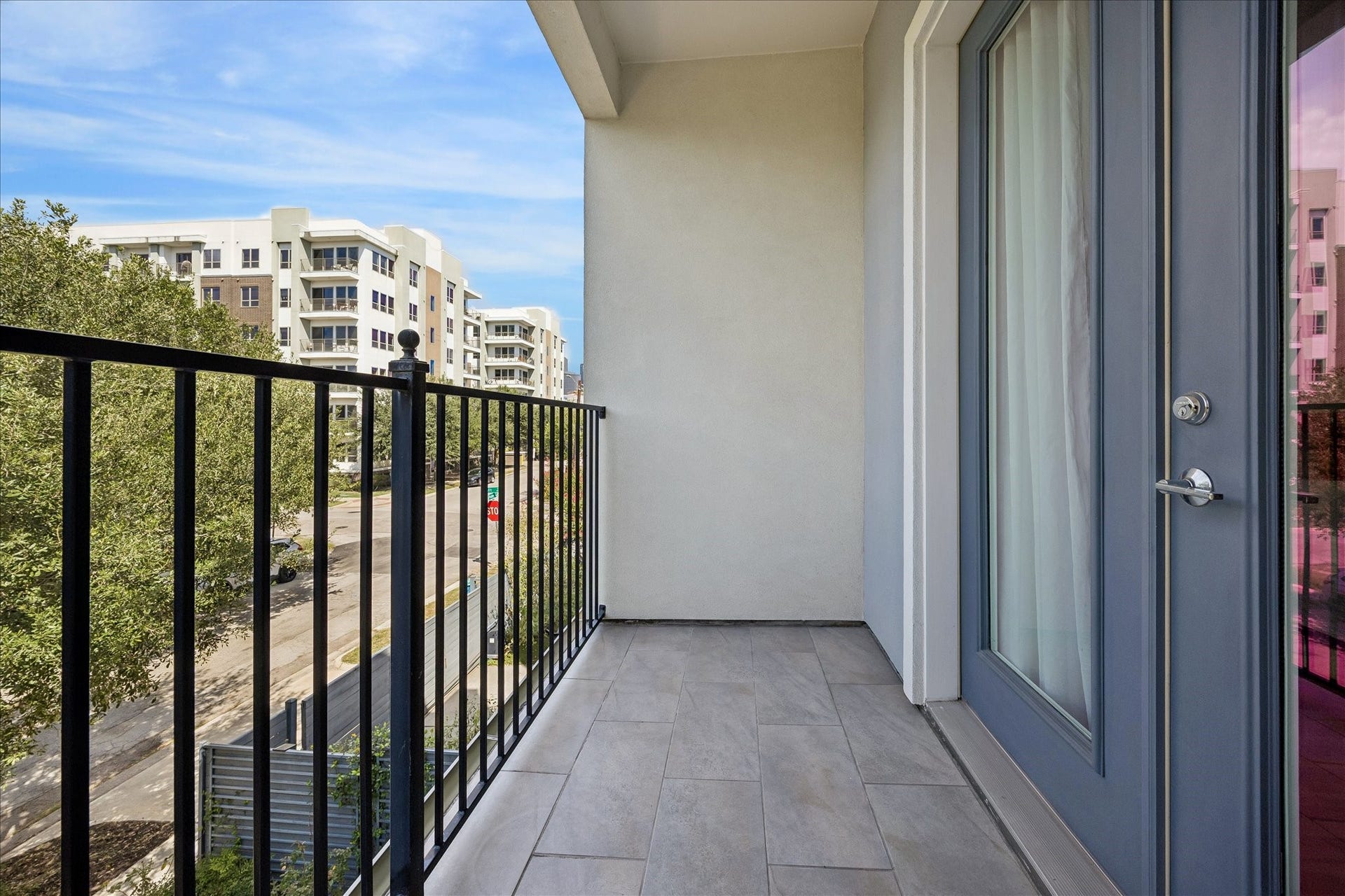 PRIVATE PATIO off the primary bedroom is a lovely spot to