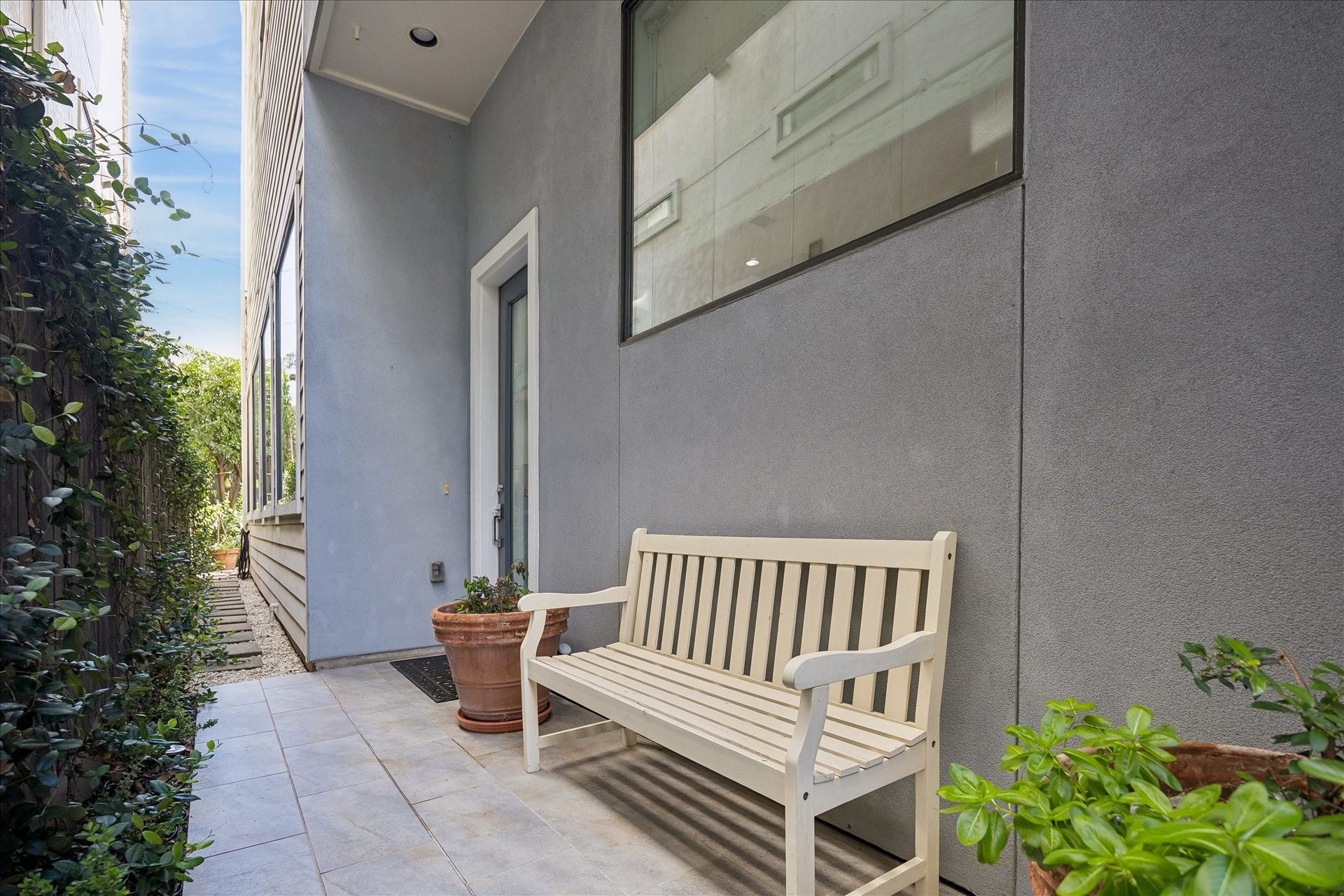 Private covered entry also leads to back patio.