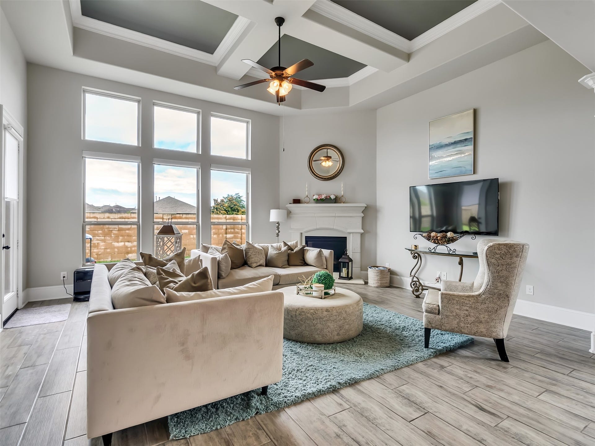 10302 Muir Peak Drive, Rosharon, TX 77583 The natural lighting, gas fireplace, and tile flooring makes this Family room shine.
