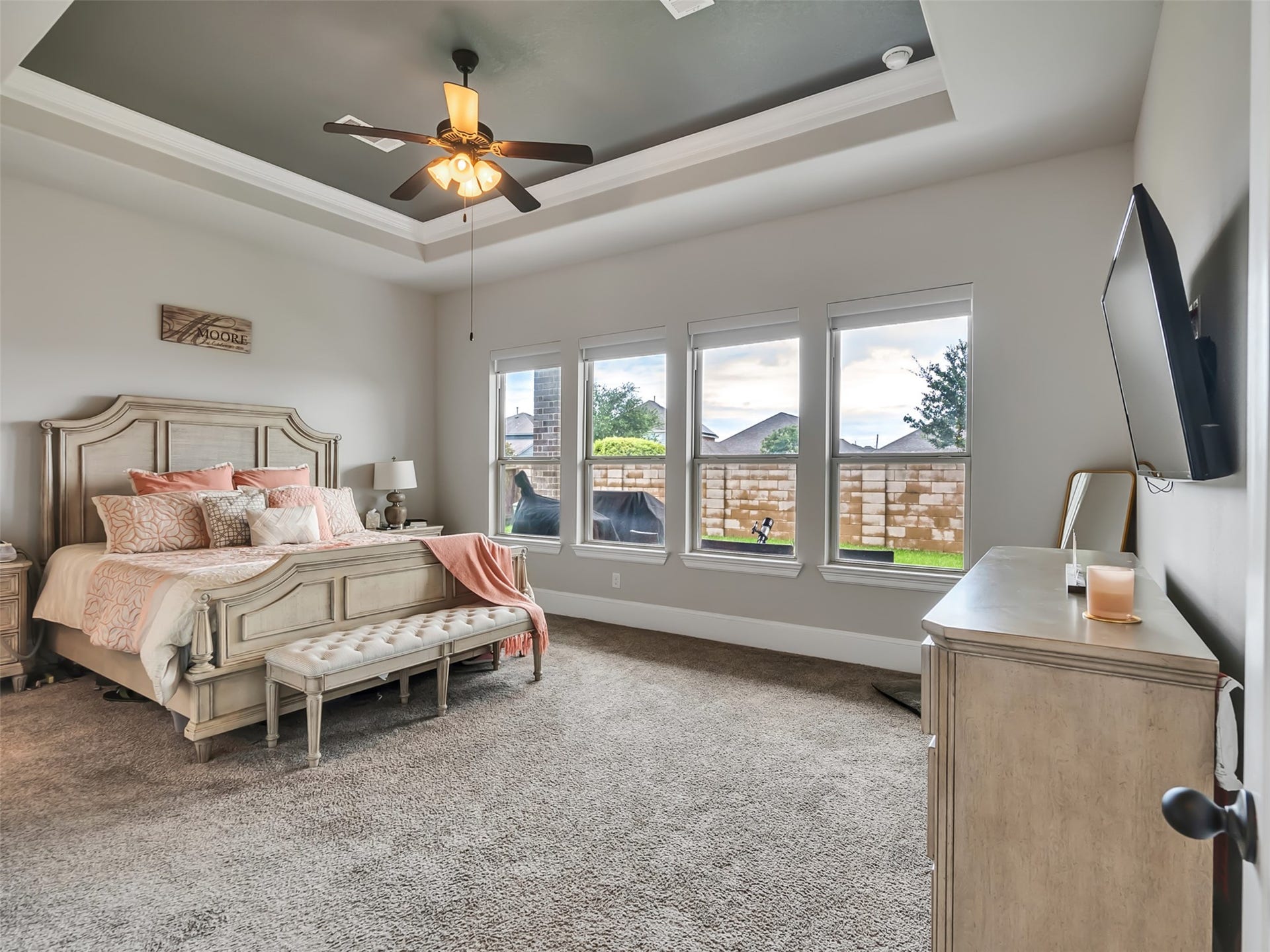10302 Muir Peak Drive, Rosharon, TX 77583 Welcome to the Primary bedroom suite where natural lighting and tray ceilings offer a comfortable and stylish ambiance.