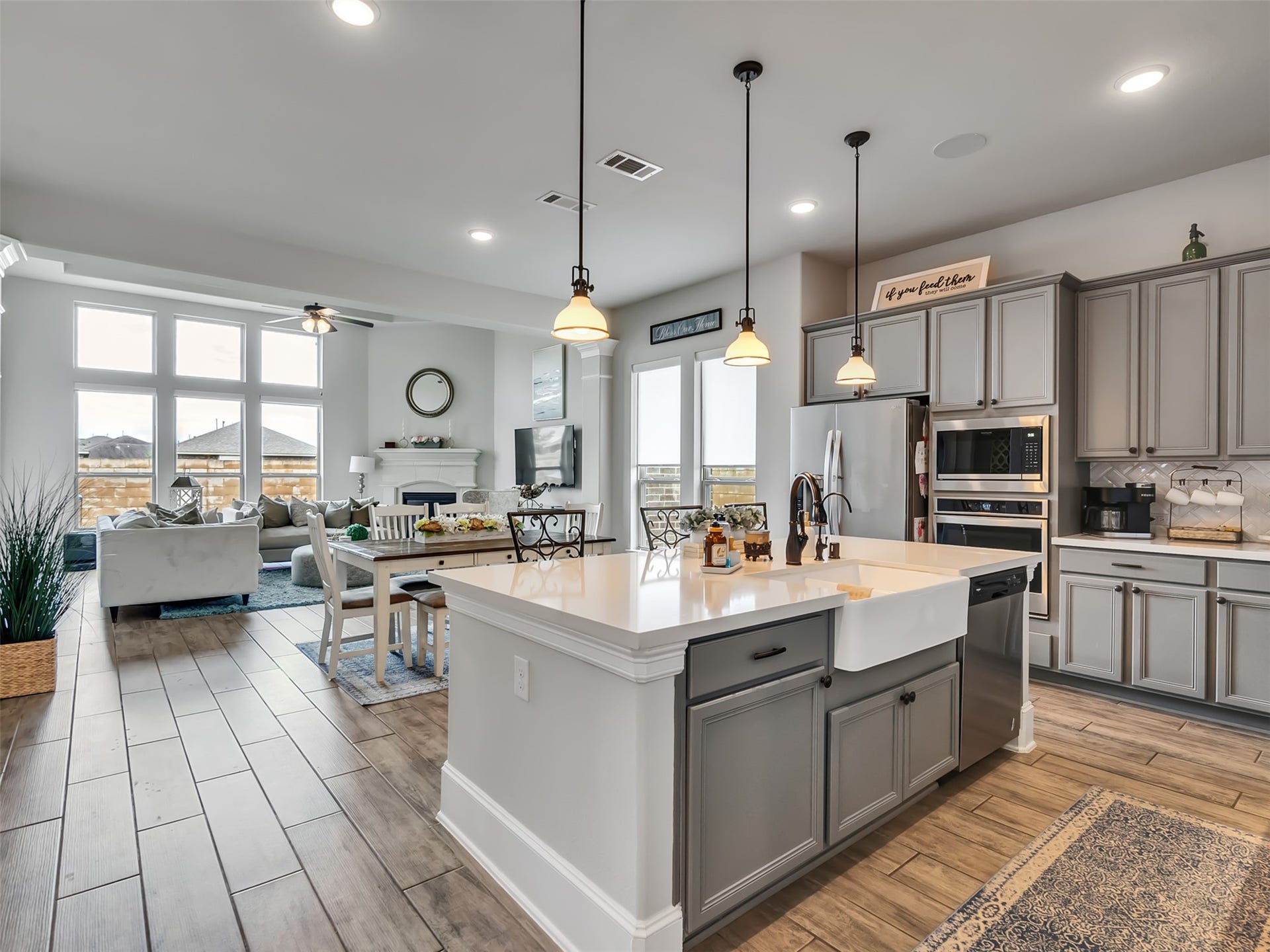 10302 Muir Peak Drive, Rosharon, TX 77583 View into Dining area and Family room from kitchen.