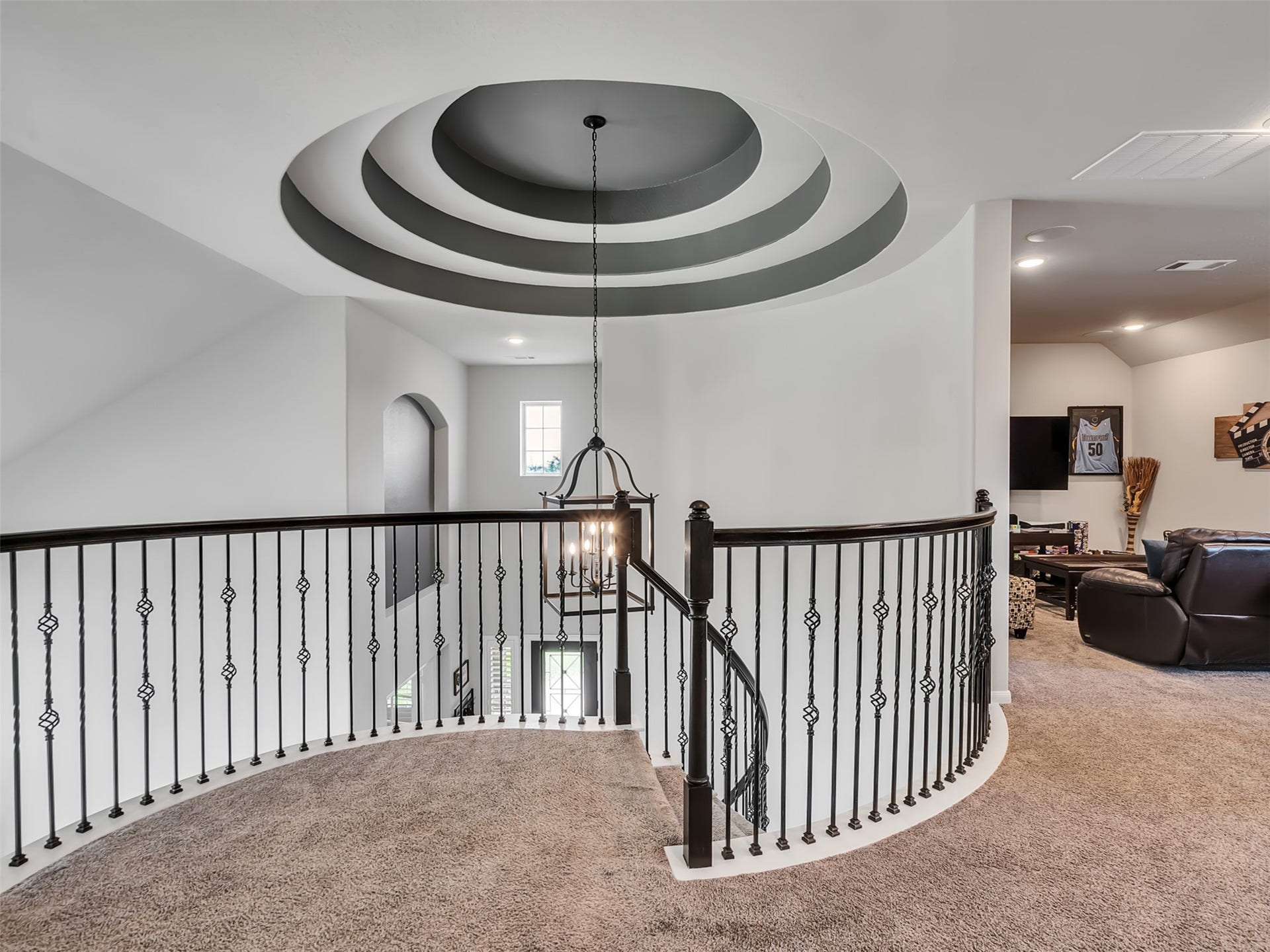 10302 Muir Peak Drive, Rosharon, TX 77583 Upstairs loft area showing the detailed tray ceilings