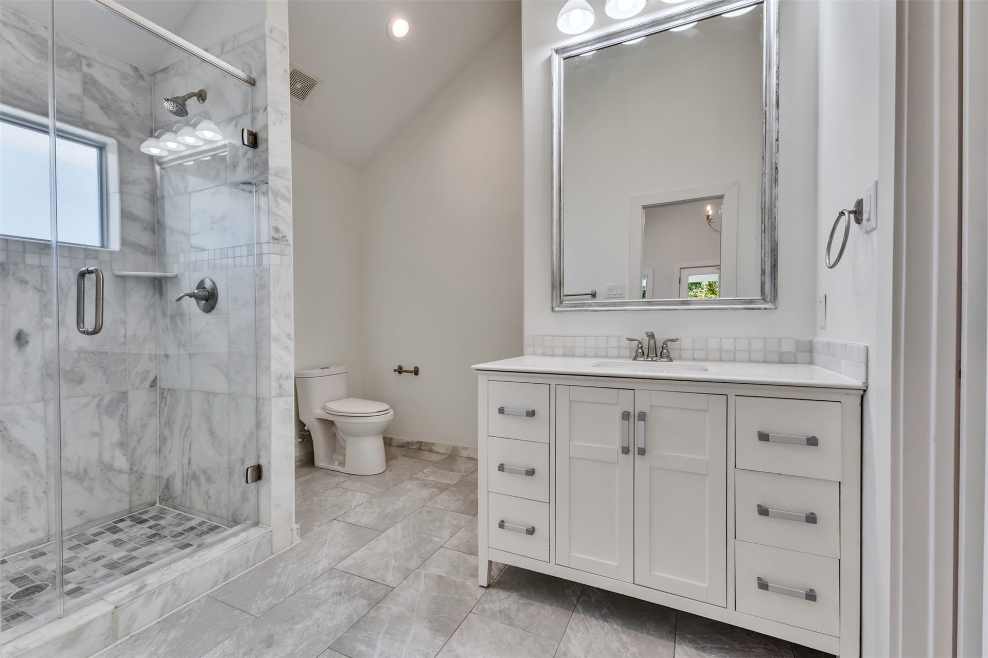 Updated bathroom with a large walk in closet.