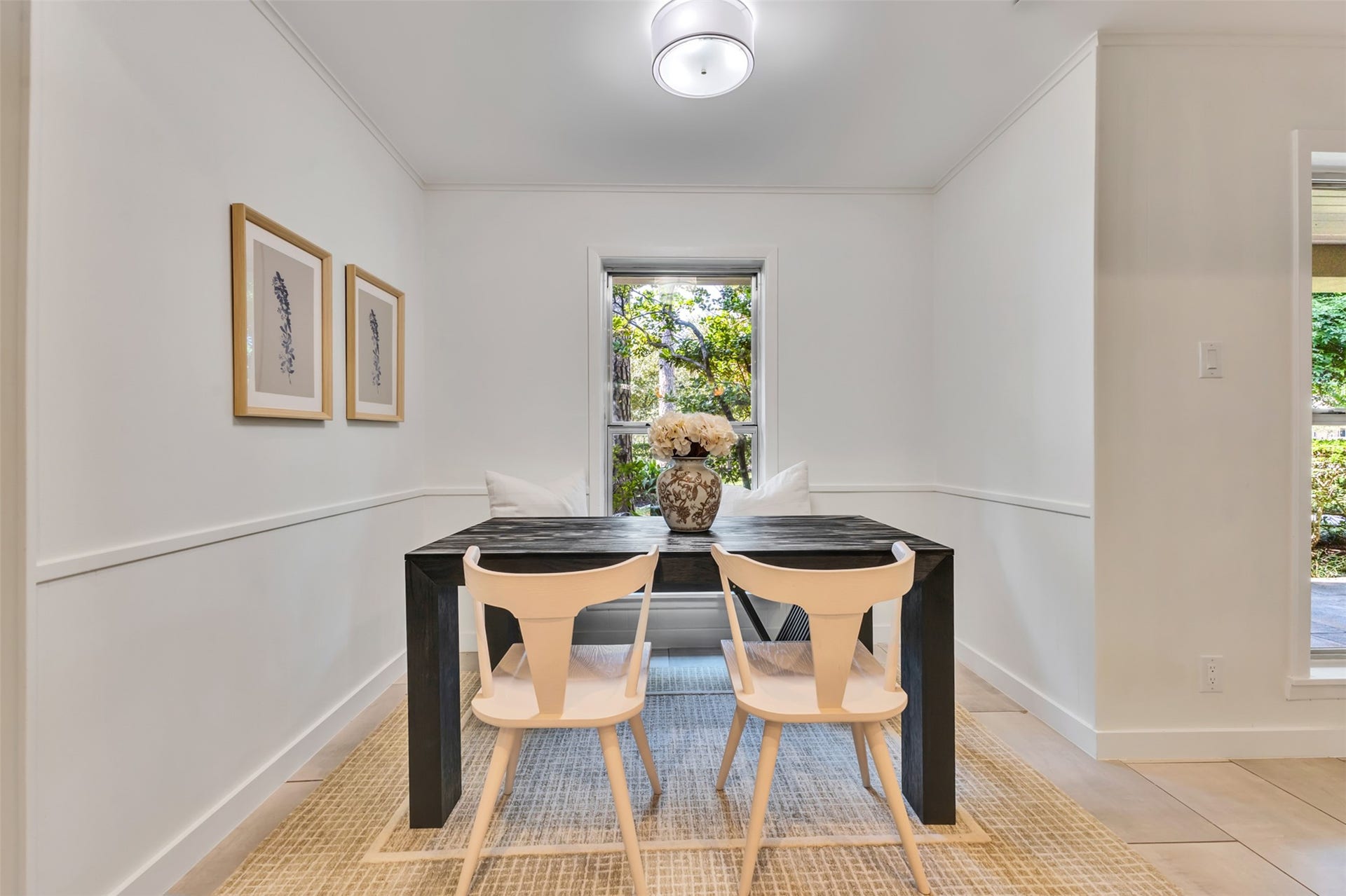Sunlit breakfast nook with picture-perfect nature views, creating a warm and peaceful space for everyday family dining