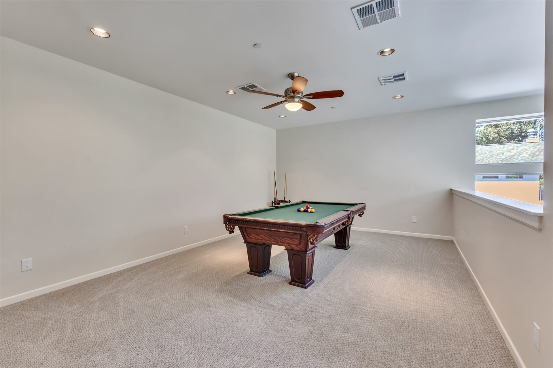 Large, versatile game room overlooking the family room belowdelivering an open, light-filled layout with endless entertainment possibilities.