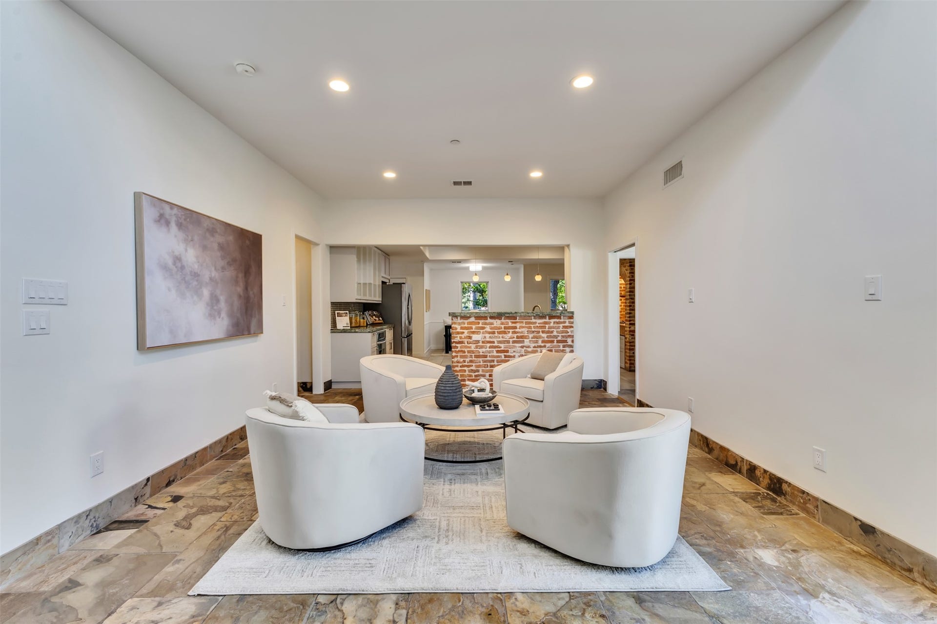 Directly off the kitchen, this grand flex spacewhether used as an expansive keeping room, main family lounge, or a play area, it offers versatility for modern family life.