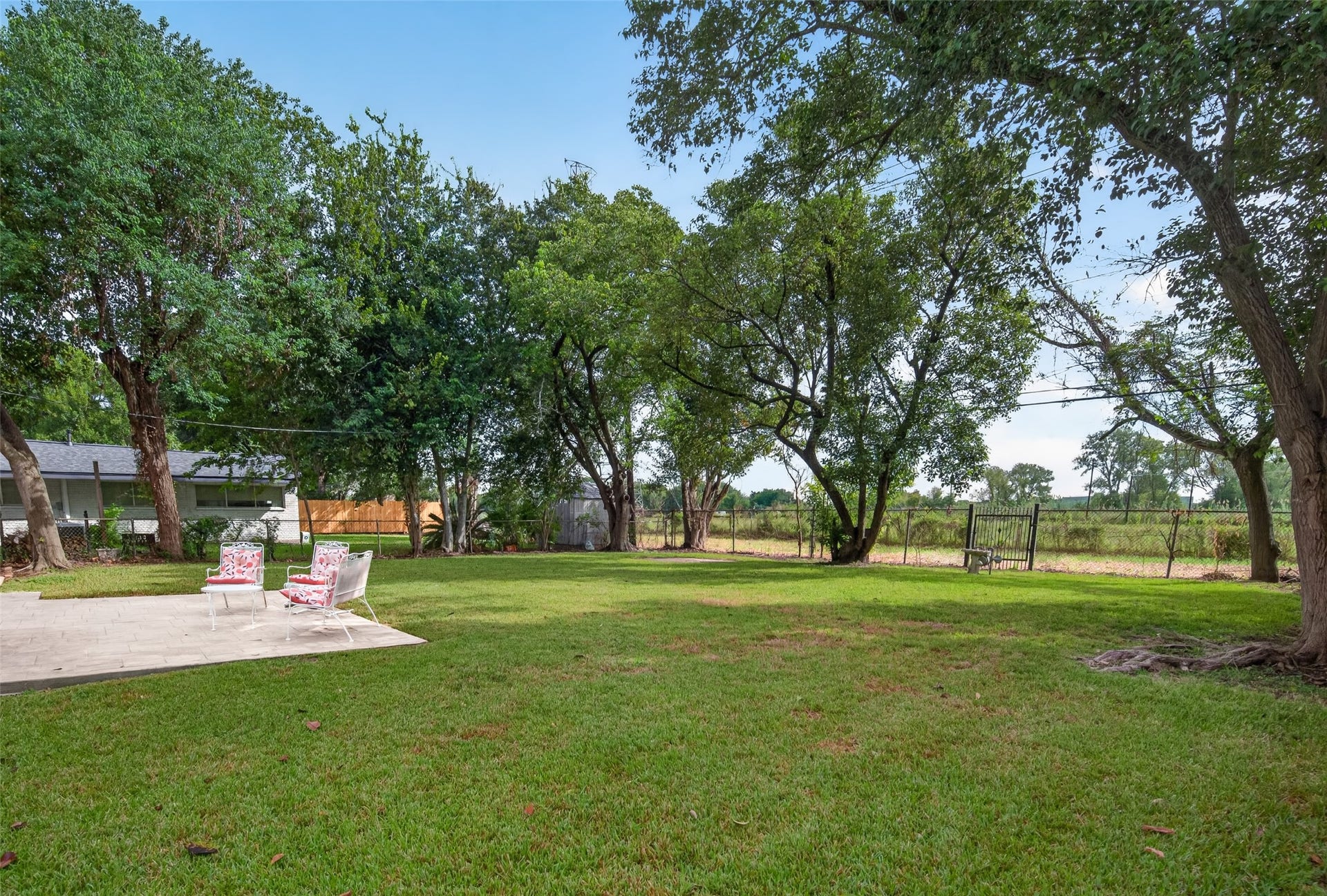 11227 Greenwillow Street, Houston, TX 77035 Another view of backyard with no neighbors behind! Nice view of easement & horse pasture. Access gate in back fence to easement area.