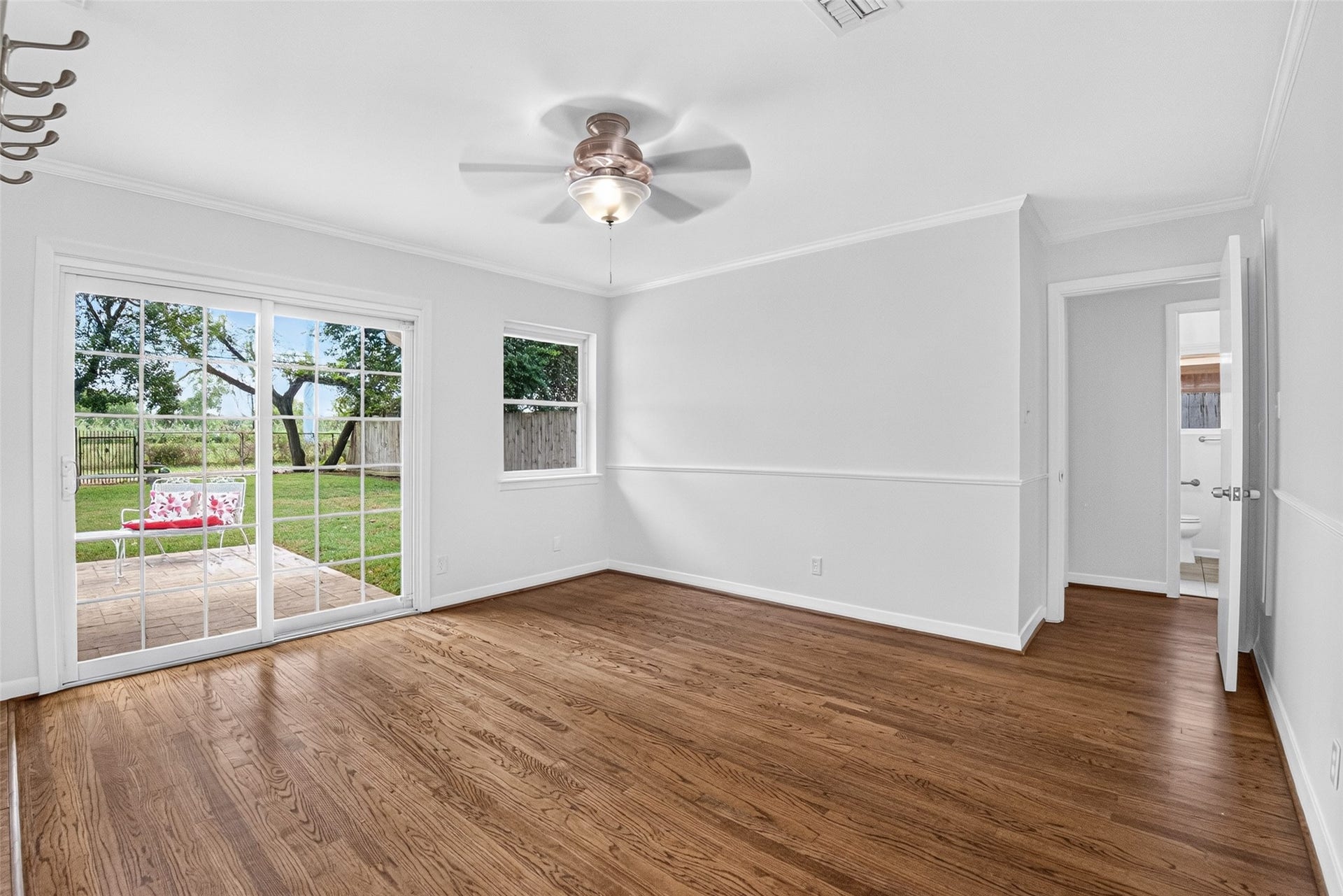 11227 Greenwillow Street, Houston, TX 77035 Bright cheerful dining area with ceiling fan, crown molding and chair rail molding too.