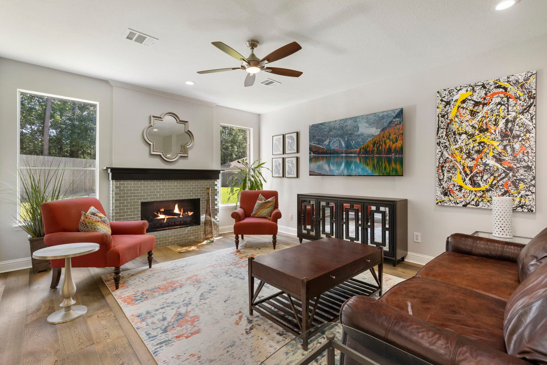 98 W Night Heron Place, The Woodlands, TX 77382 Large windows bring in an abundance of natural light and create a bright, airy atmosphere throughout the main living space.