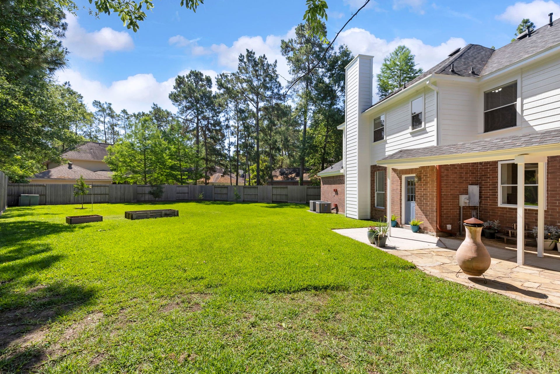 98 W Night Heron Place, The Woodlands, TX 77382 Enjoy a spacious backyard with plenty of room for pets, play, gardening, or future outdoor additions.