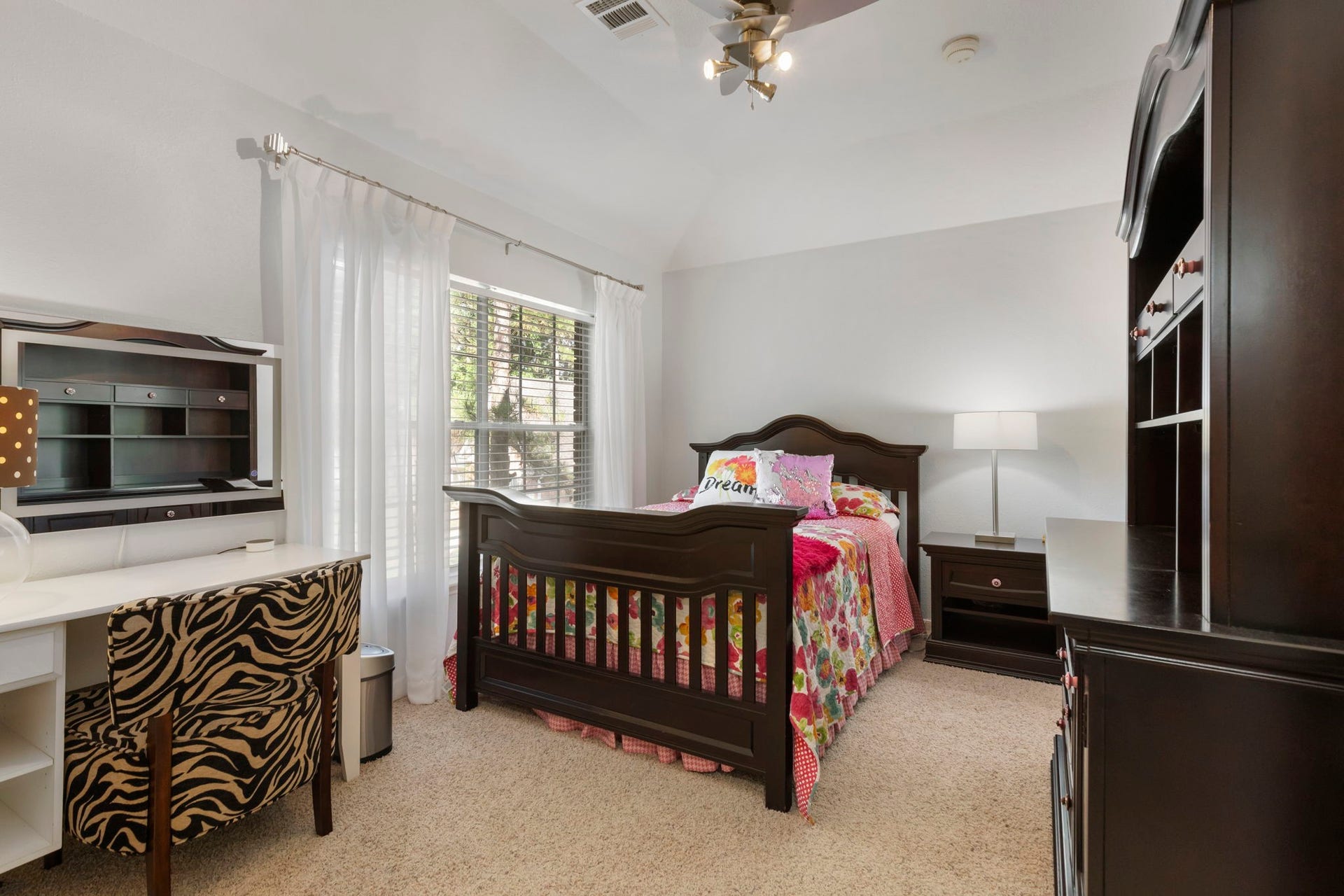 98 W Night Heron Place, The Woodlands, TX 77382 Large windows and vaulted ceilings give each bedroom an open and airy feel while maintaining comfort and privacy.