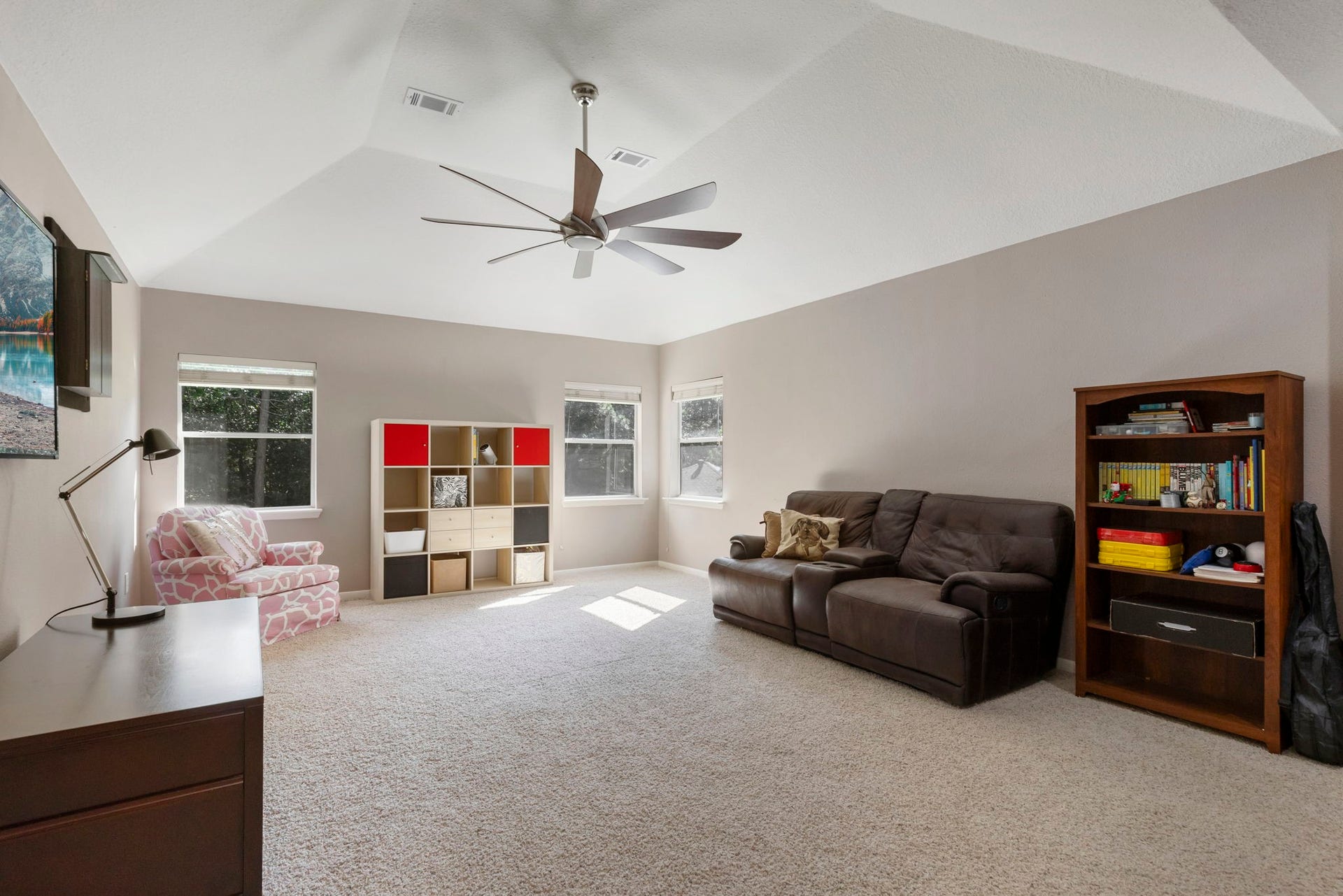98 W Night Heron Place, The Woodlands, TX 77382 The oversized upstairs game room offers endless possibilities for movie nights, play space, or a second living area.