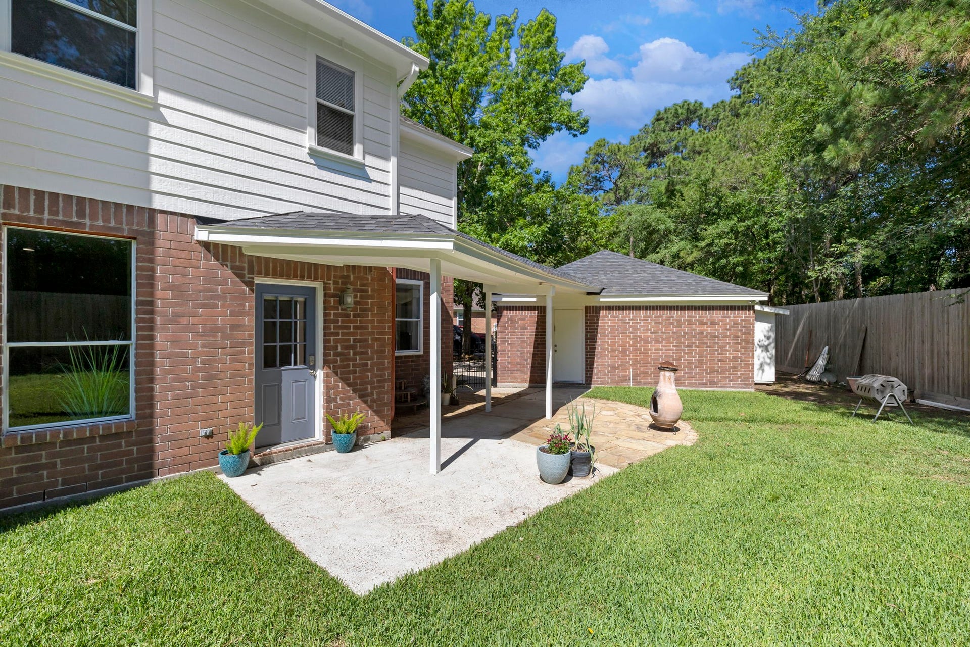 98 W Night Heron Place, The Woodlands, TX 77382 Covered back patio creates the perfect space for outdoor dining, relaxing, or entertaining guests year-round.