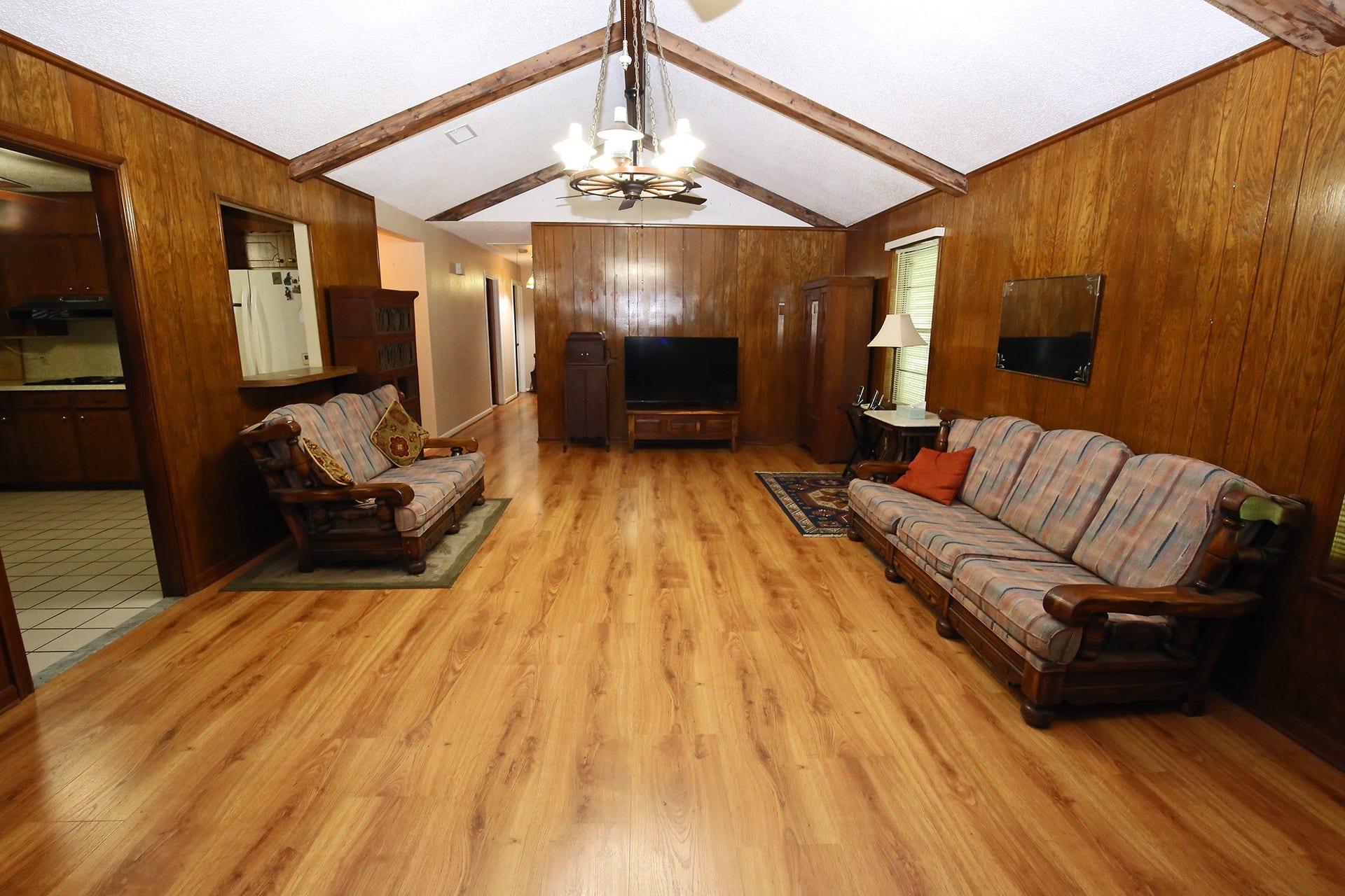 3804 Shady Lane, Santa Fe, TX 77517 This expansive living room exudes warmth and comfort, perfect for relaxation and entertaining.
