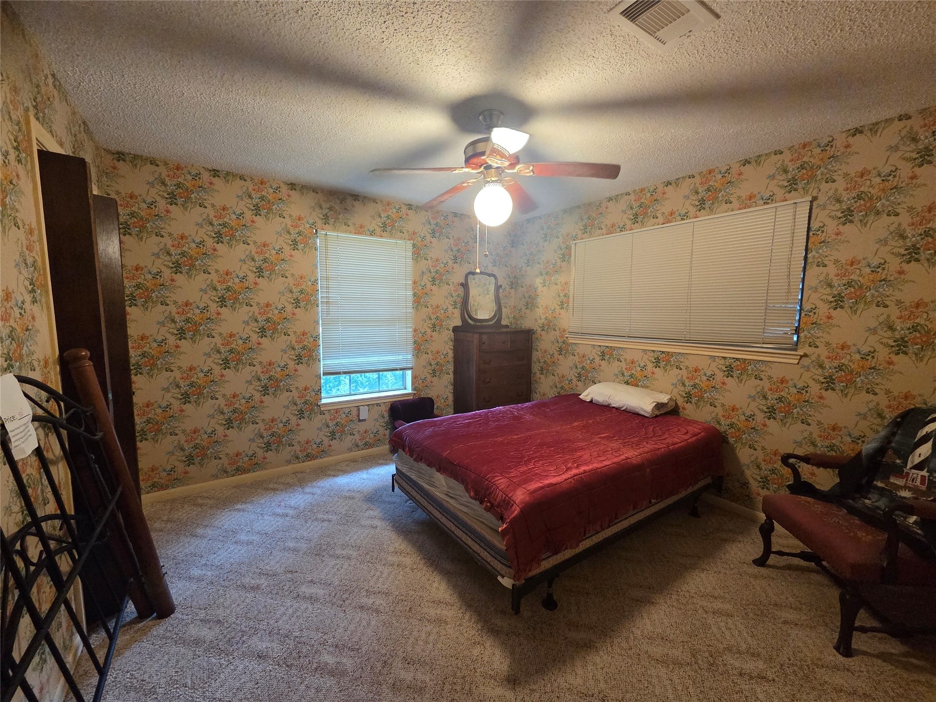 3804 Shady Lane, Santa Fe, TX 77517 Cozy secondary bedroom with ample natural light and charming floral wallpaper.