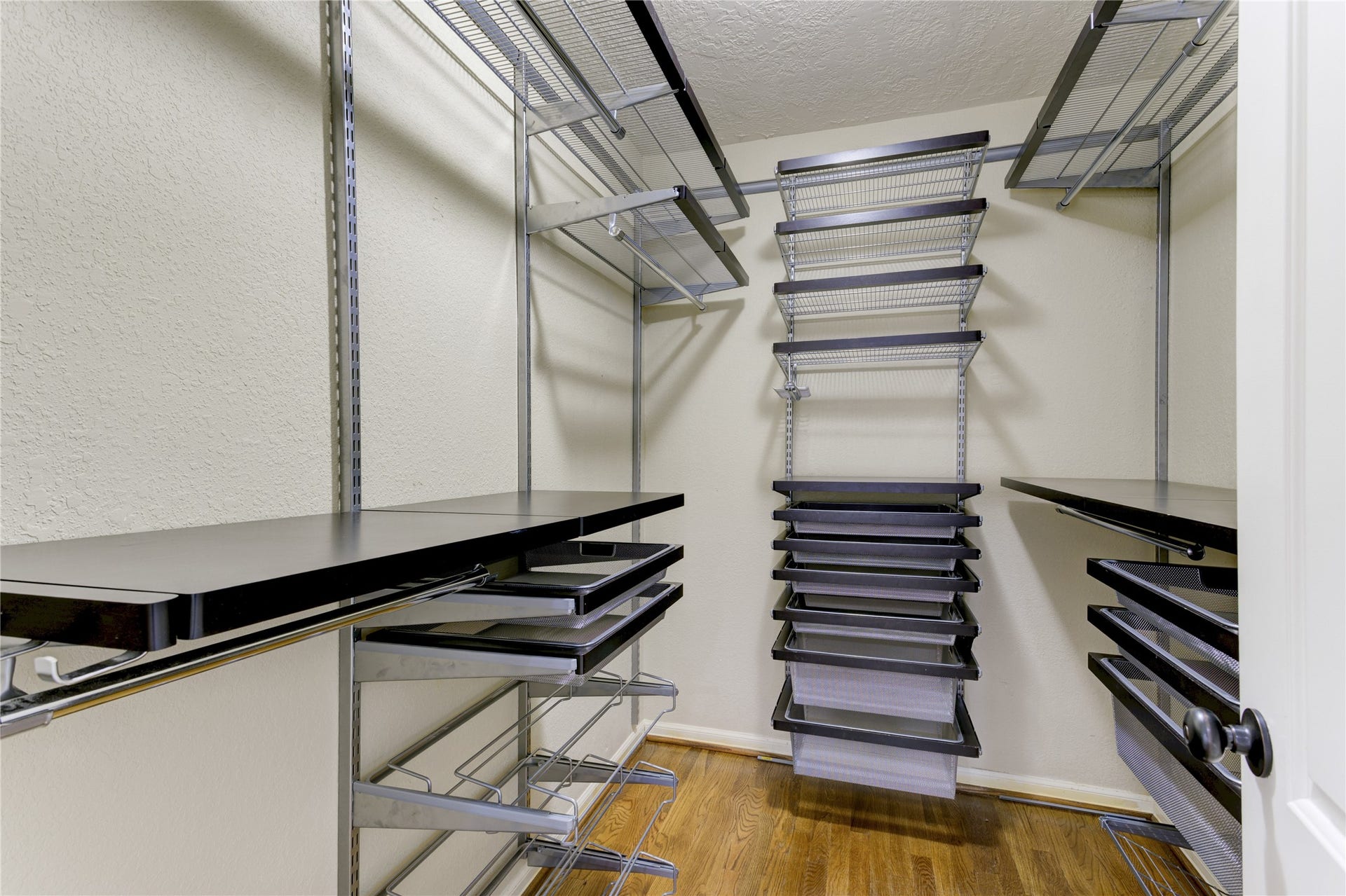 3007 Topham Circle, Houston, TX 77018 Primary closet with custom shelving system.