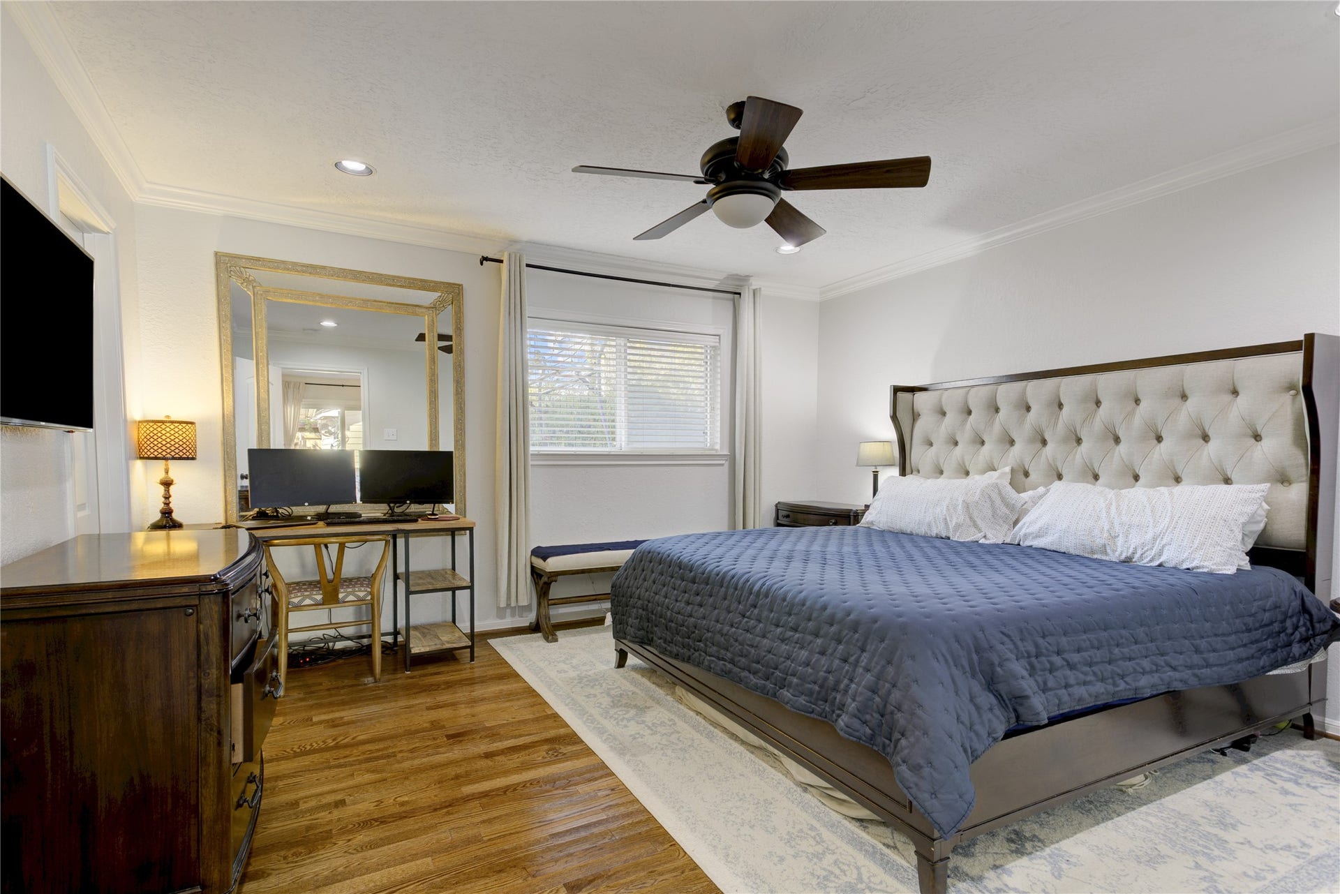 3007 Topham Circle, Houston, TX 77018 Tucked at the back of the home, the primary suite offers a spacious bedroom, ensuite bathroom, and walk-in closet with a custom storage system.