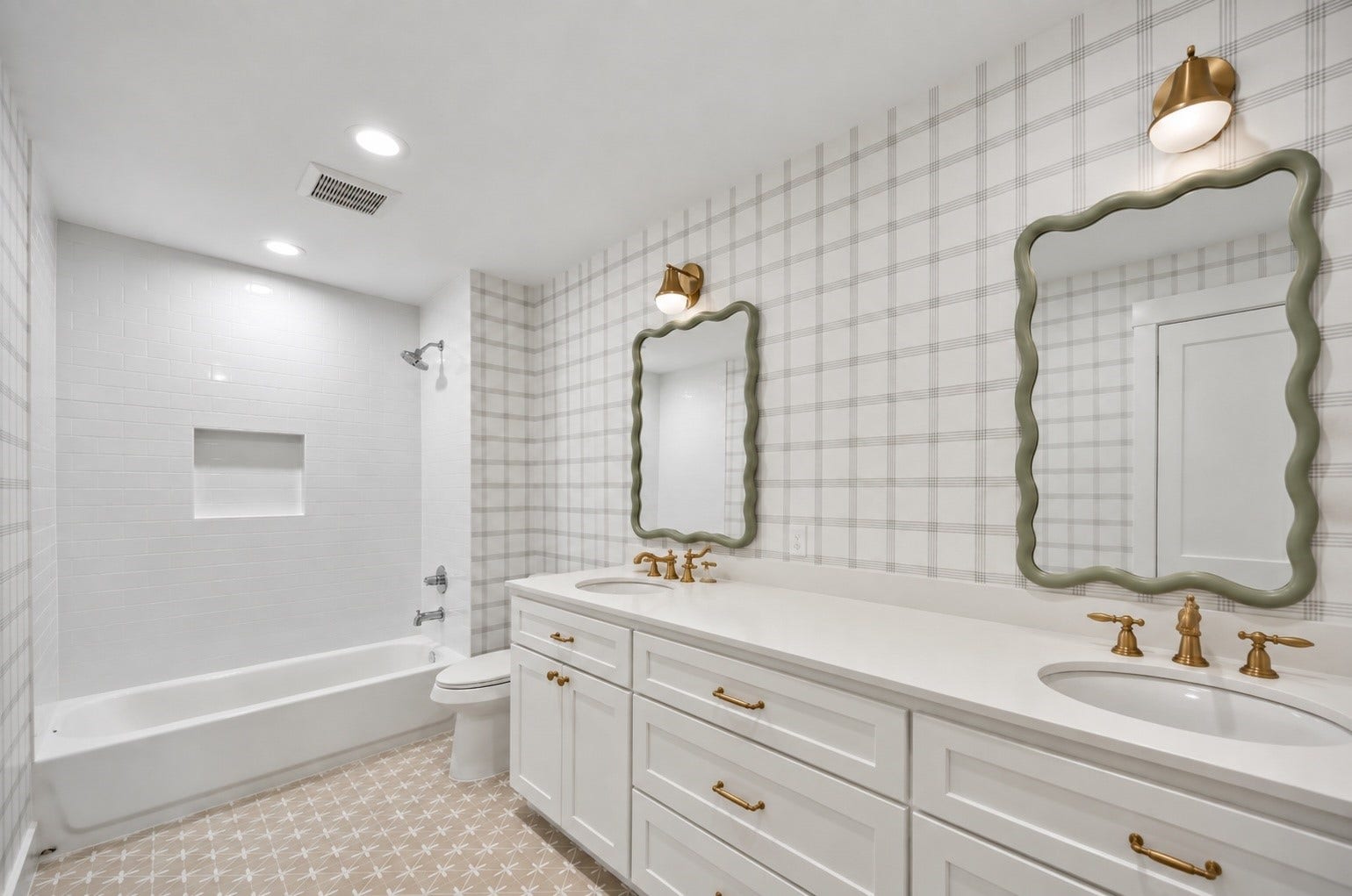 10659 Mayfield Road, Houston, TX 77043 This secondary bathroom, located near the three additional bedrooms, features dual sinks with stylish framed mirrors, providing ample space for shared use. The elegant fixtures complement the clean, white cabinetry, while the patterned floor tiles add a touch of charm. The combination of a bathtub and a spacious shower ensures both convenience and comfort.