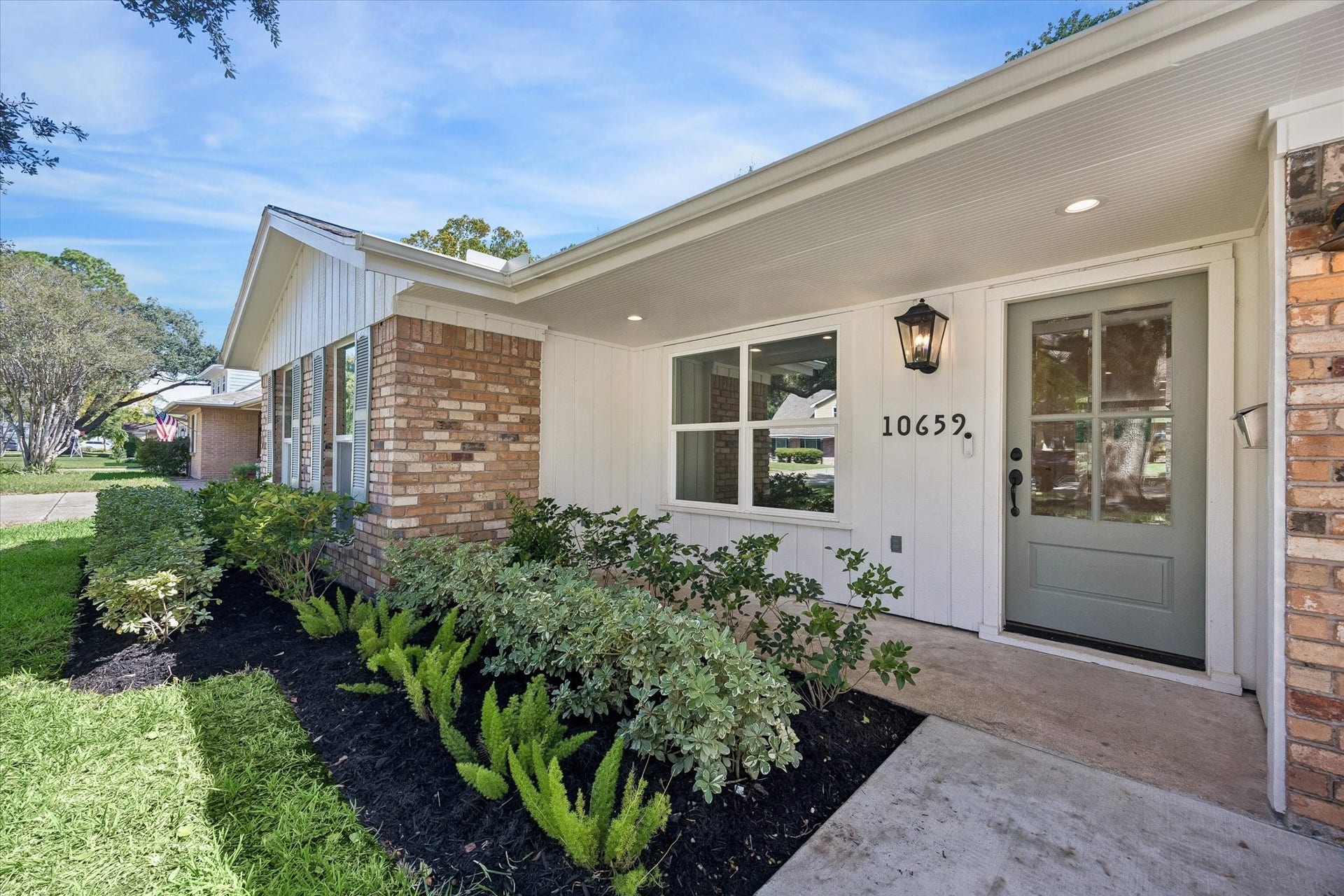 10659 Mayfield Road, Houston, TX 77043 A closer look at the covered front entry highlights the homes thoughtful exterior updates, including fresh landscaping, classic brick detailing and a soft sage front door. Deep overhangs provide a sheltered approach while preserving the homes inviting ranch style character.