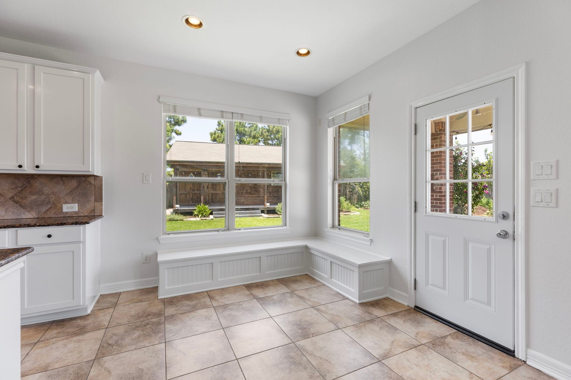 Eat in kitchen space with builtin seating with storage.