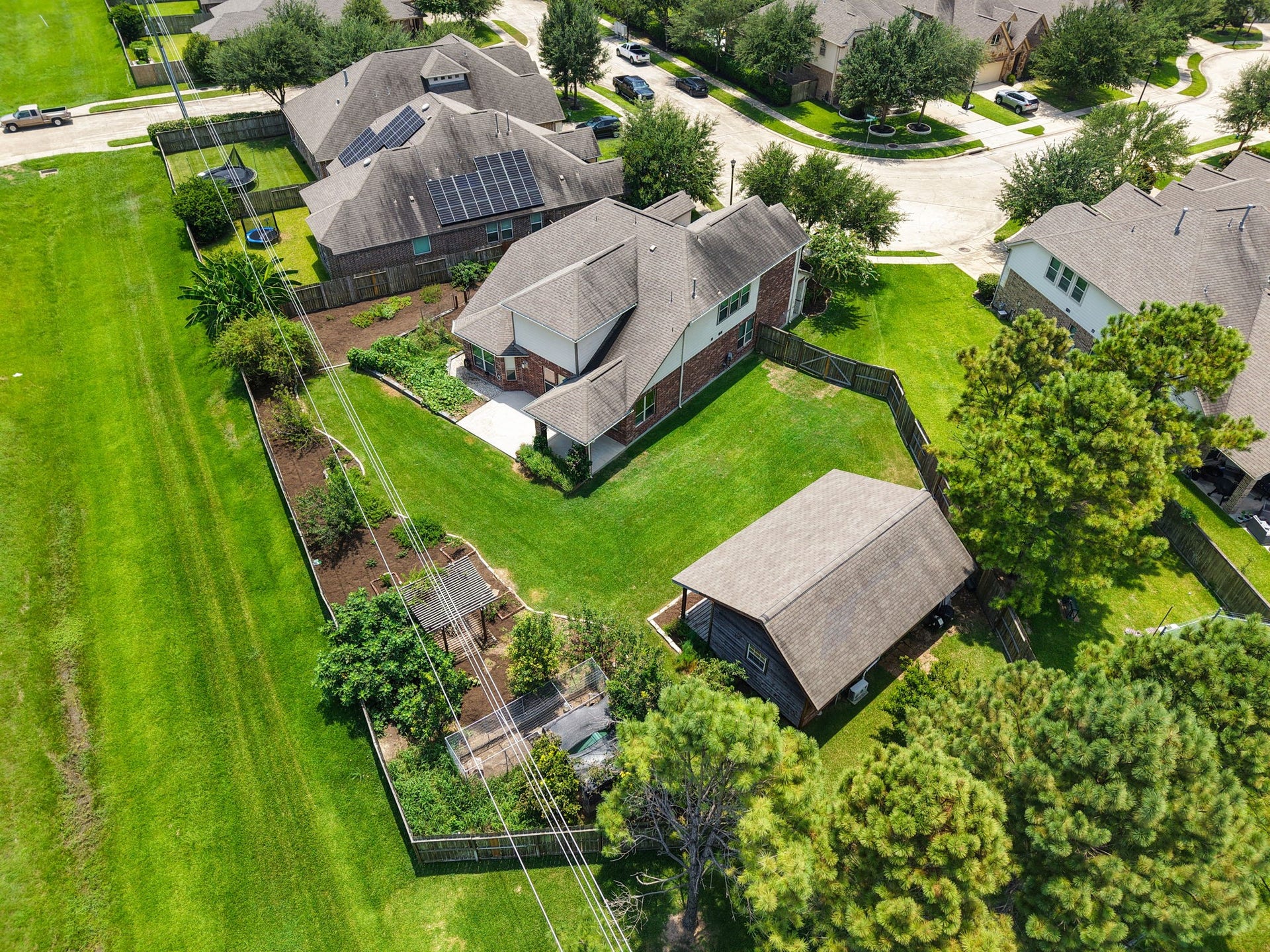 There are no immediate neighbors behind or to the left of the property.