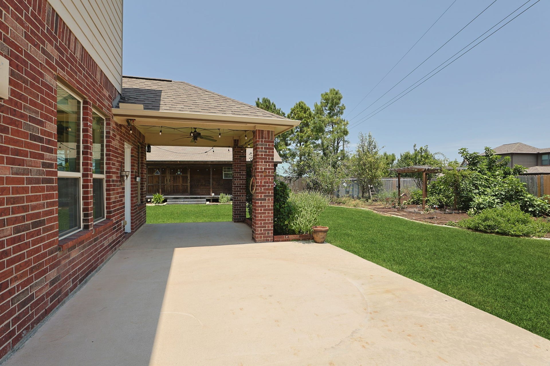 There is a large patio space off of the kitchen.  Part is covered and the other section is wired for a jacuzzi!
