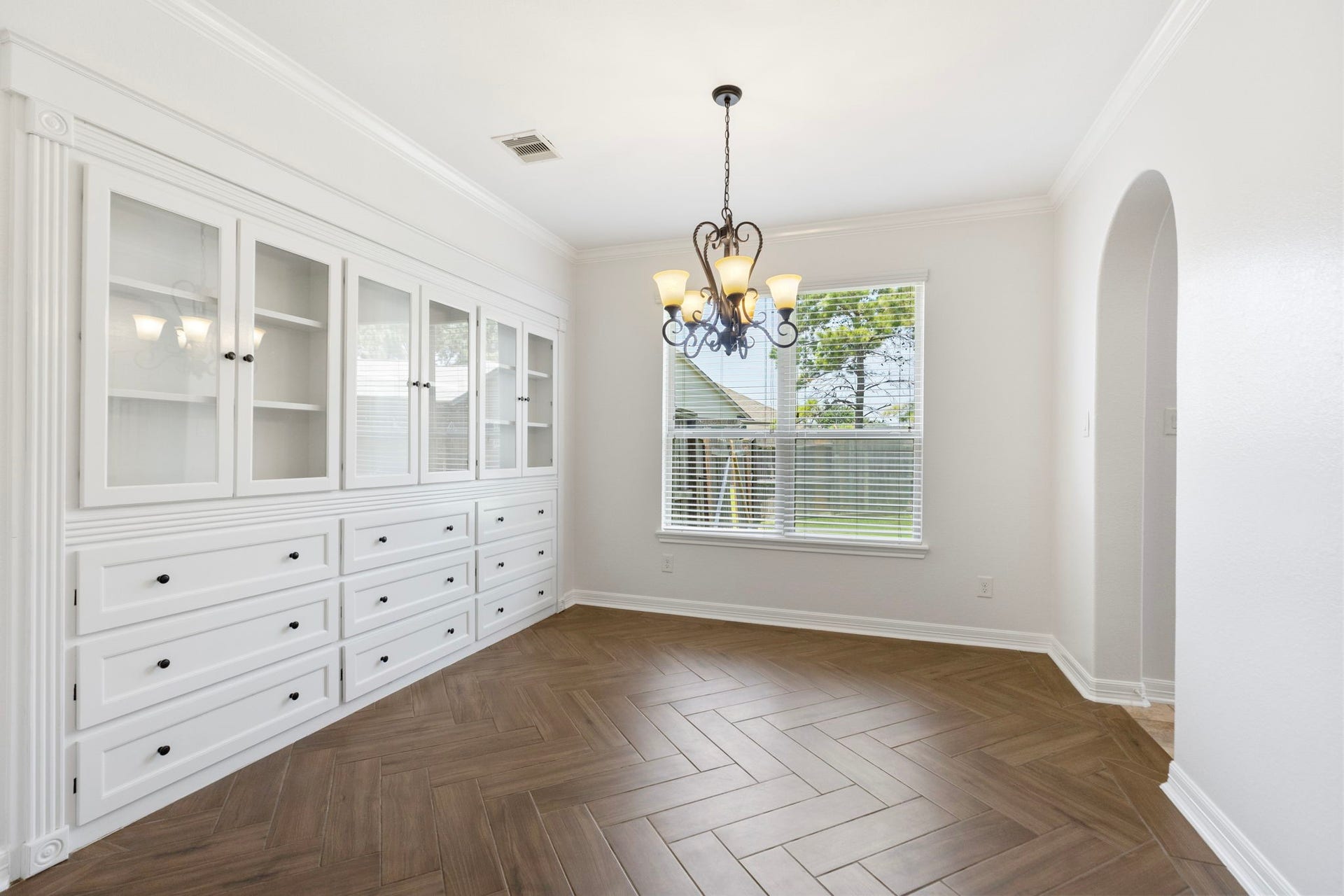 The seller built custom cabinets and display shelves.