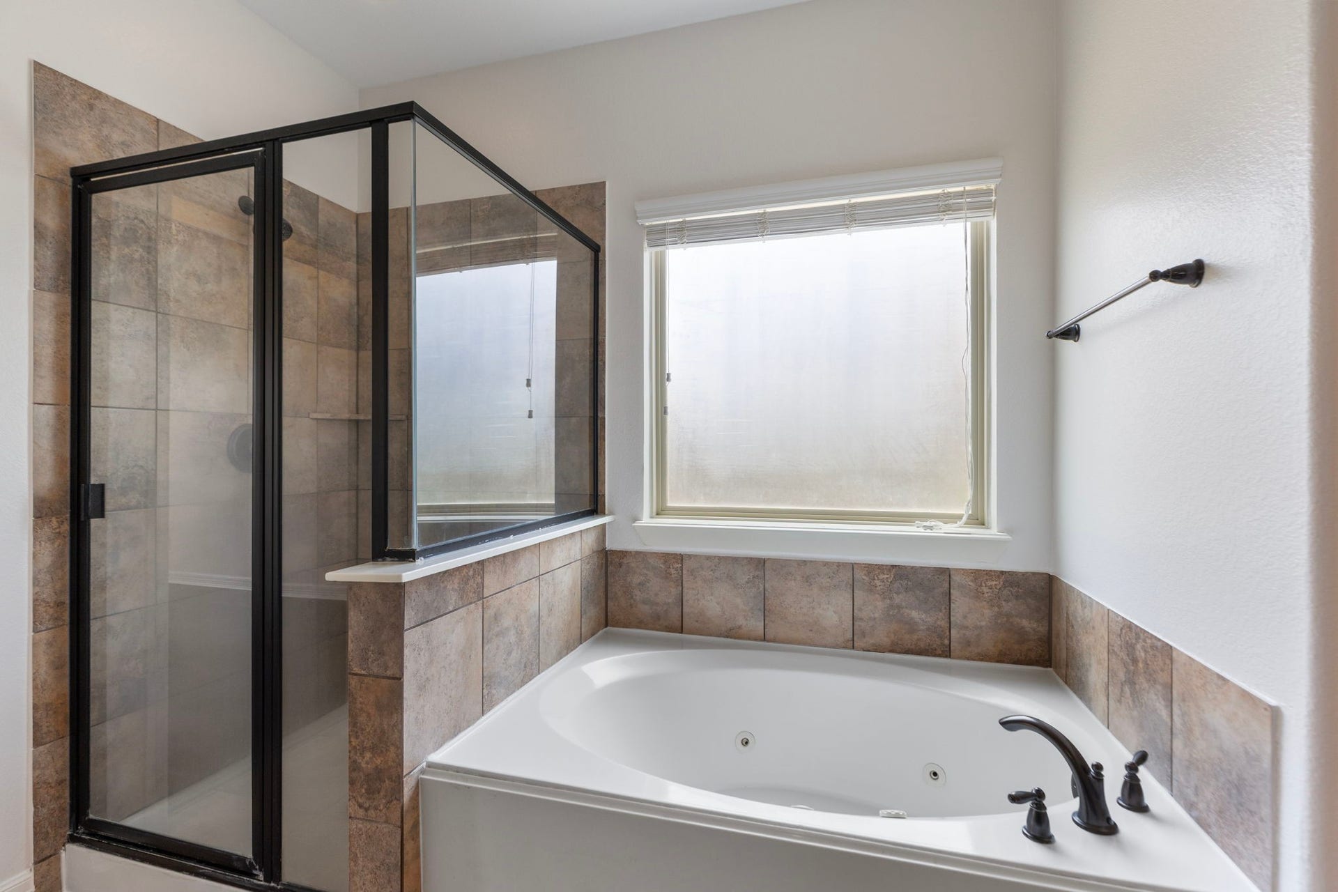 Separate shower and jacuzzi tub.