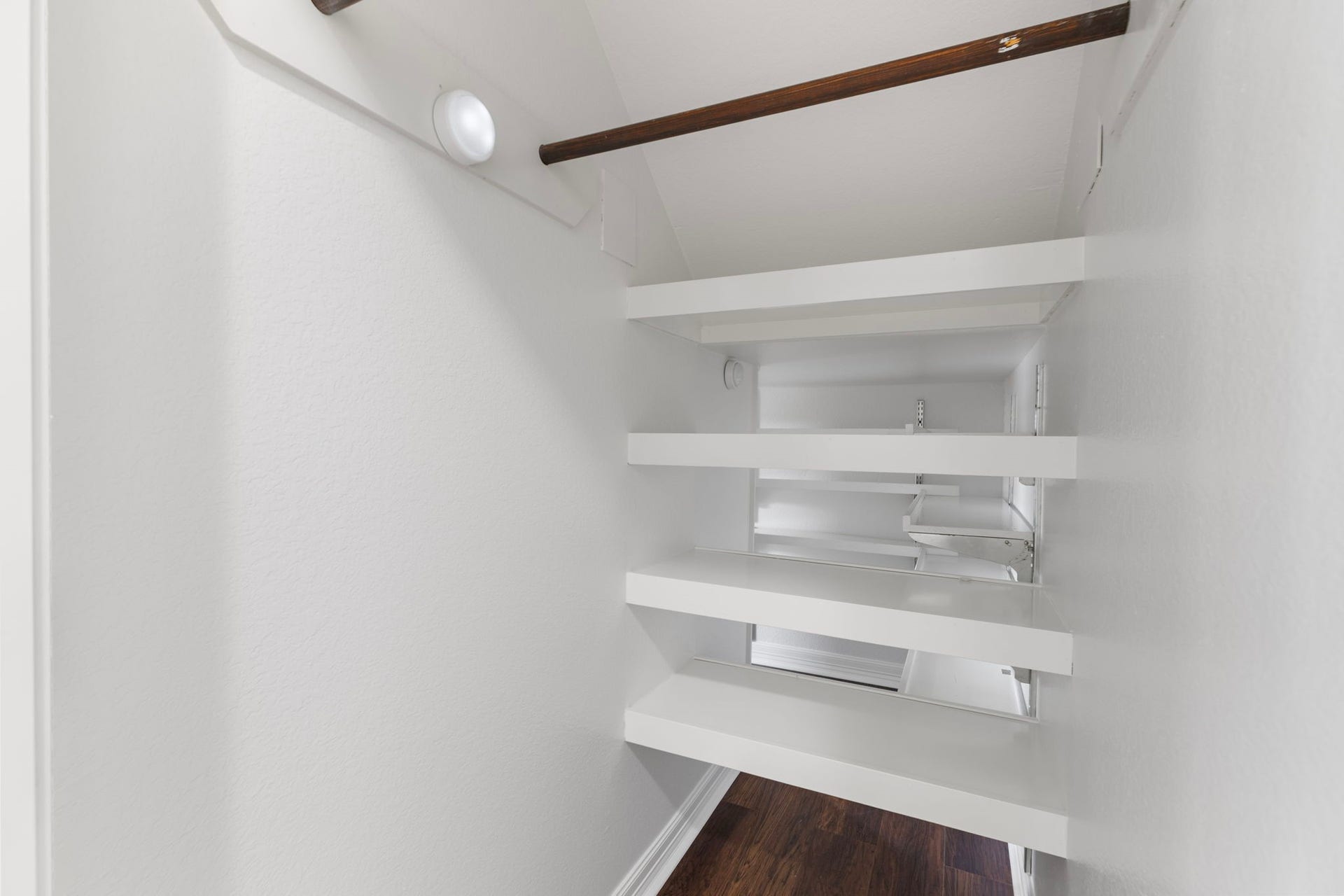 Front part of under the stairs Coat closet and storage.